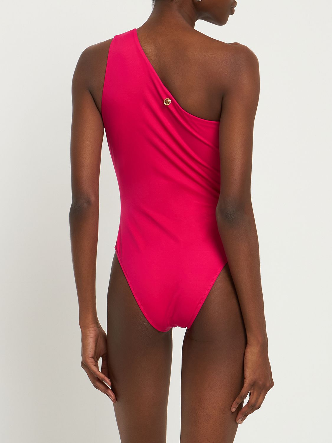 Elegant fuchsia one-piece swimsuit with a bare shoulder