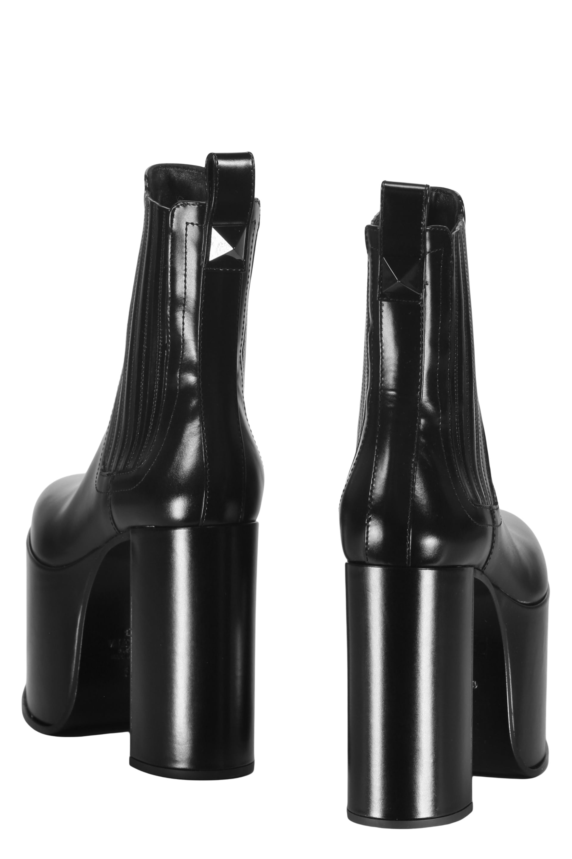 Shiny black boots with thick soles