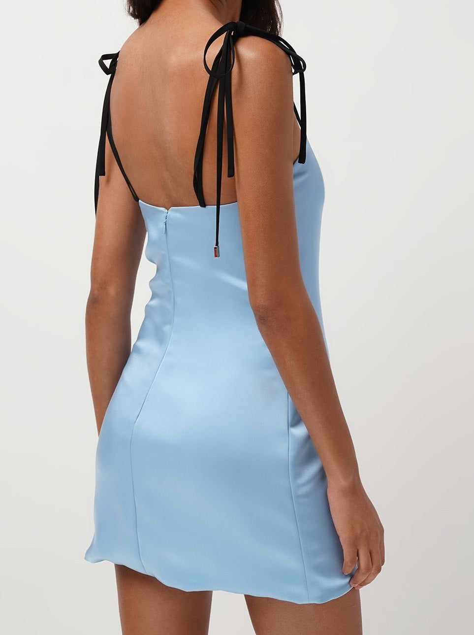 Short blue dress with black bows