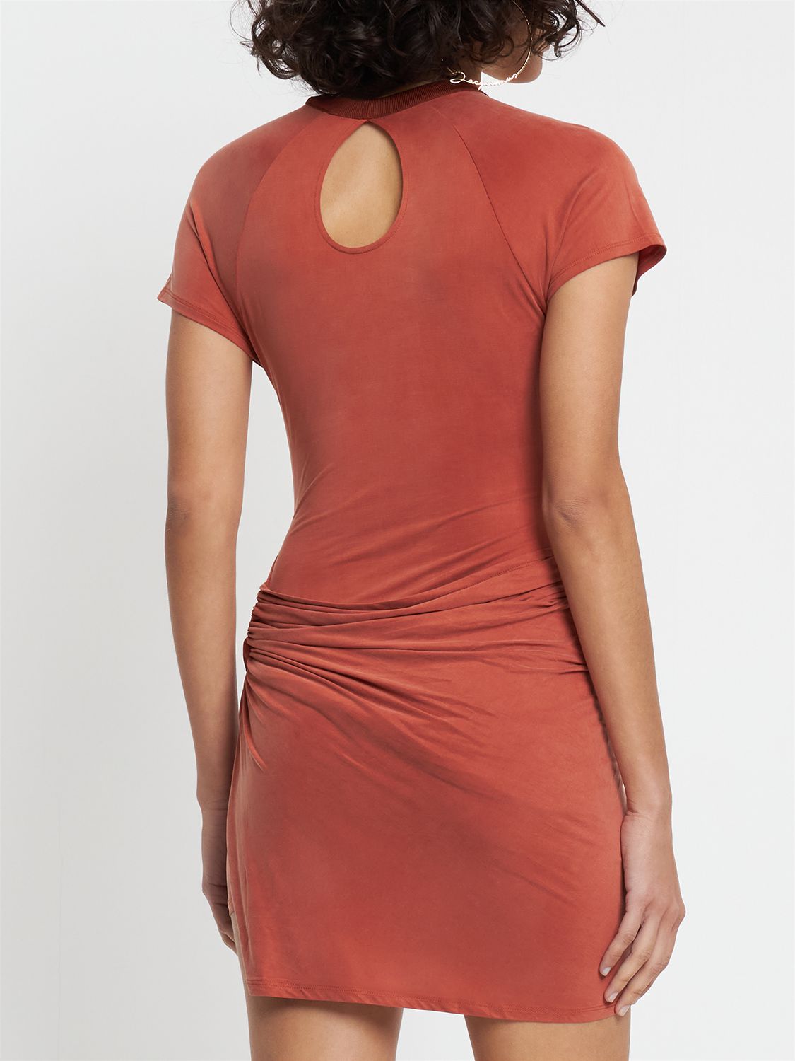 Red fitted dress with cut-out details