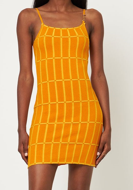 Fitted orange dress with vertical pattern