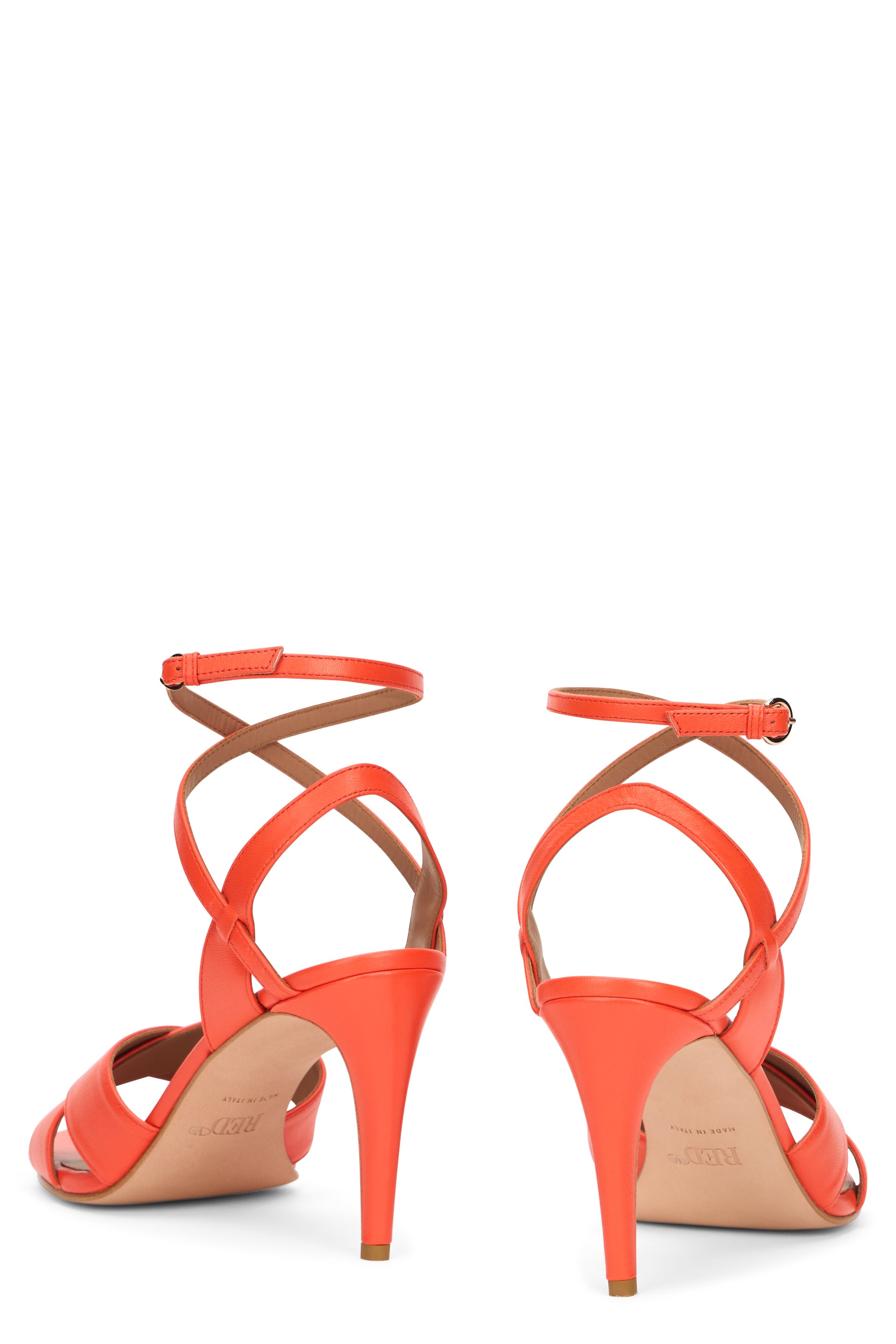 Elegant orange sandals with a high heel.