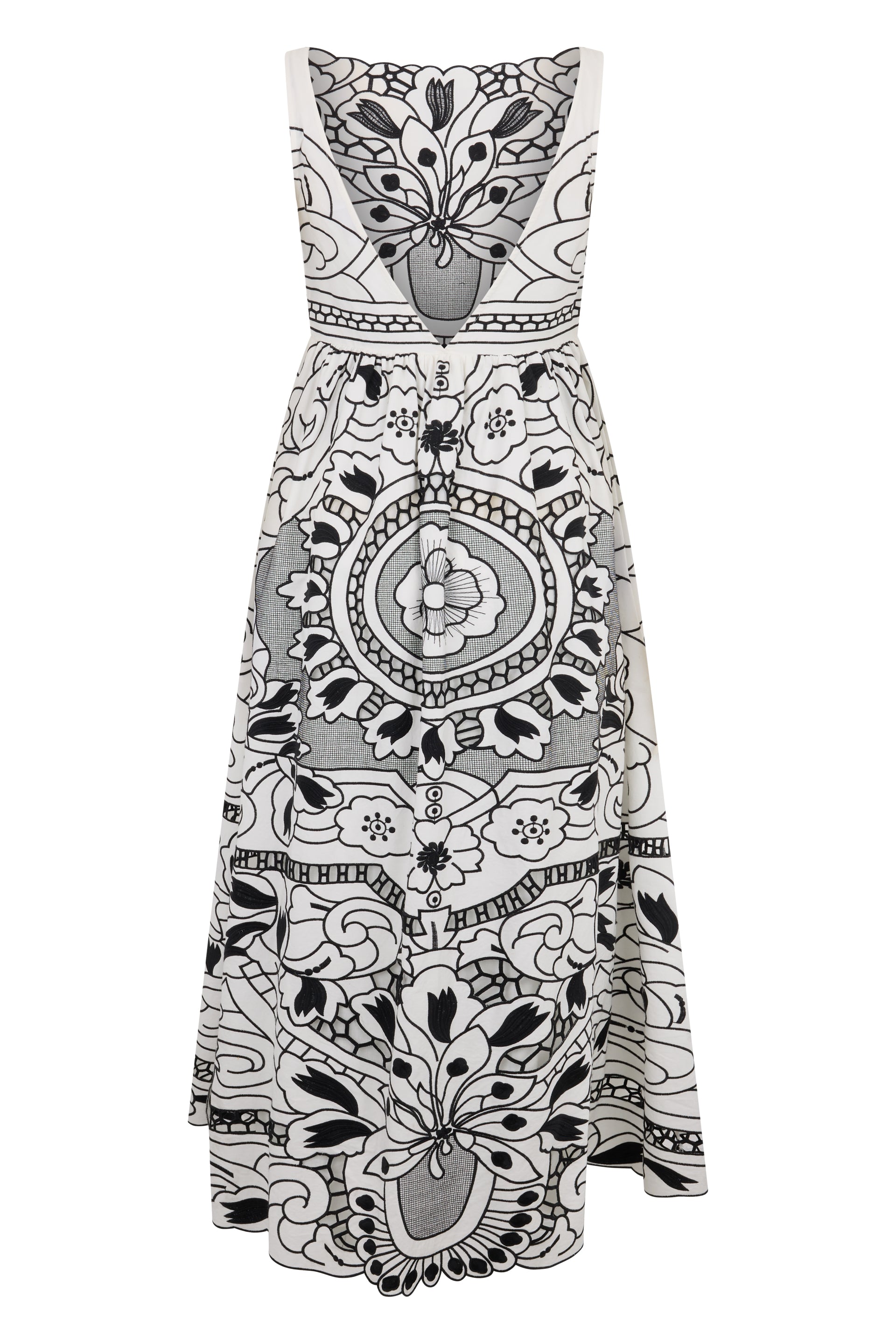 Elegant dress without sleeves in white color with black print.