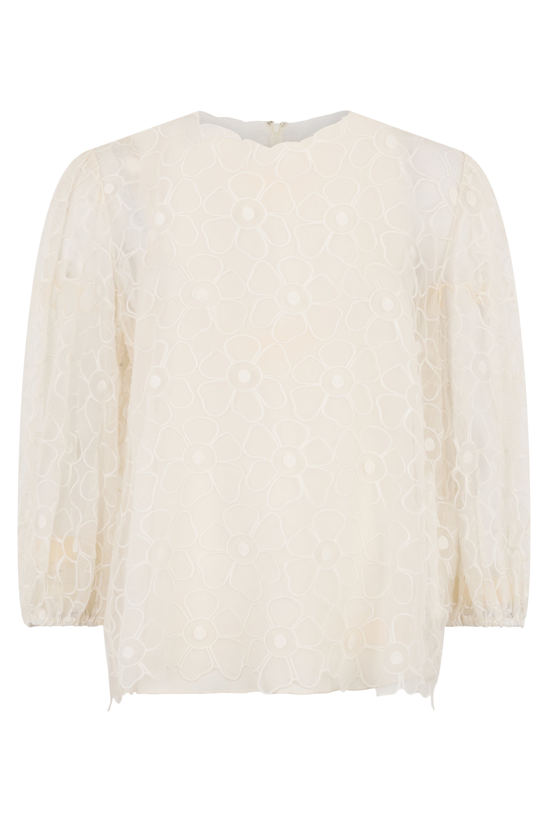 White cream blouse with long sleeves.