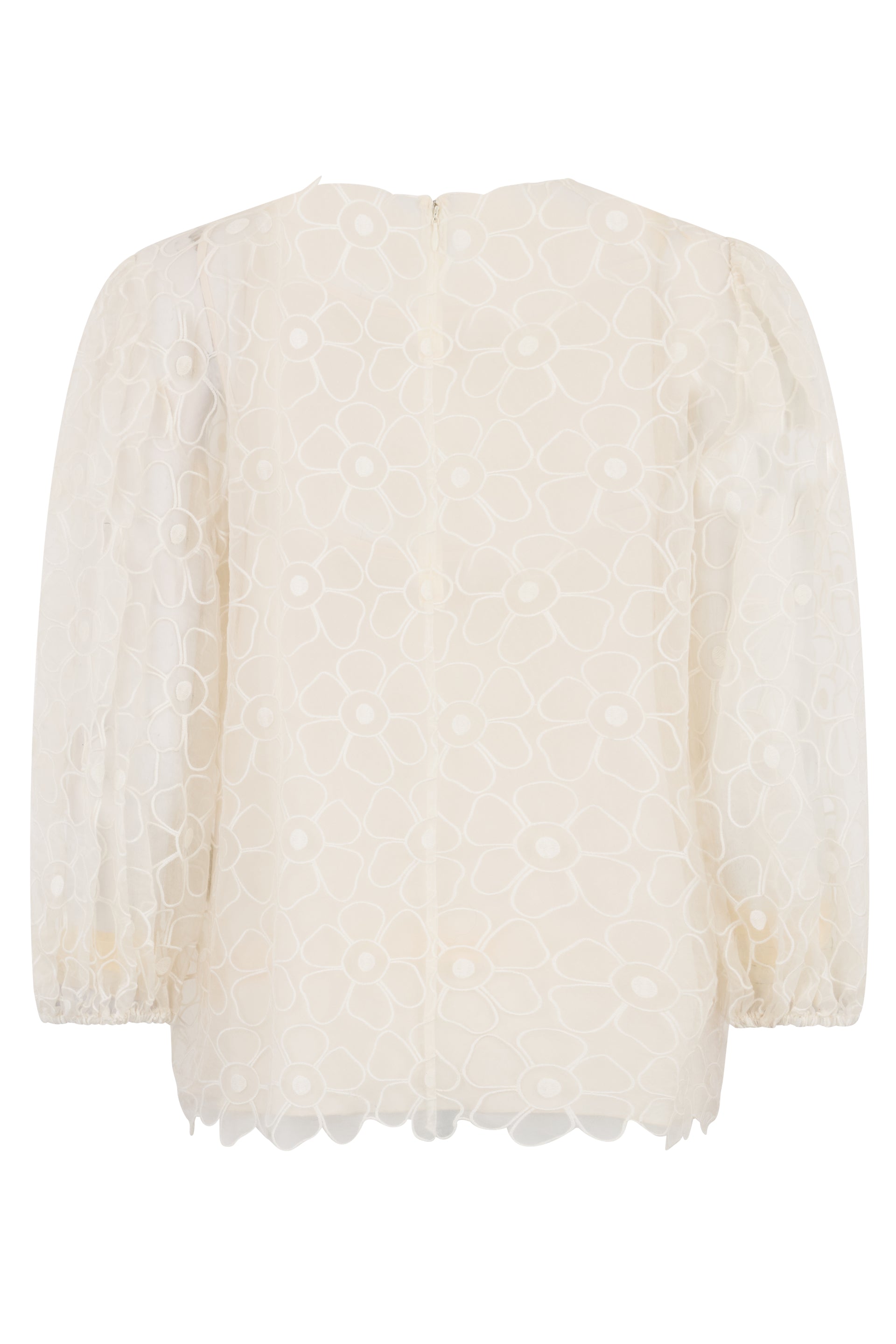 White cream blouse with long sleeves.