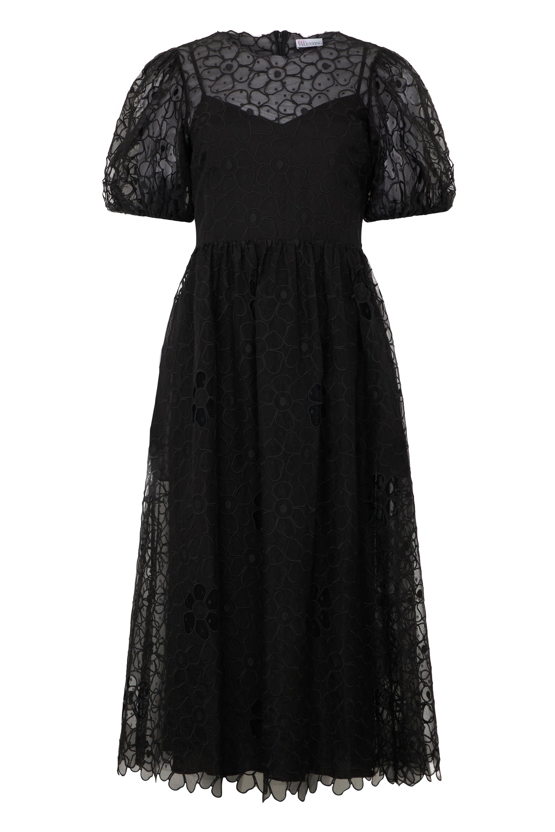 Elegant long black dress with tulle and flowers.