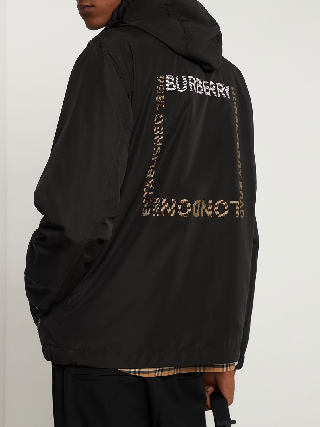 Black windbreaker with adjustable hood