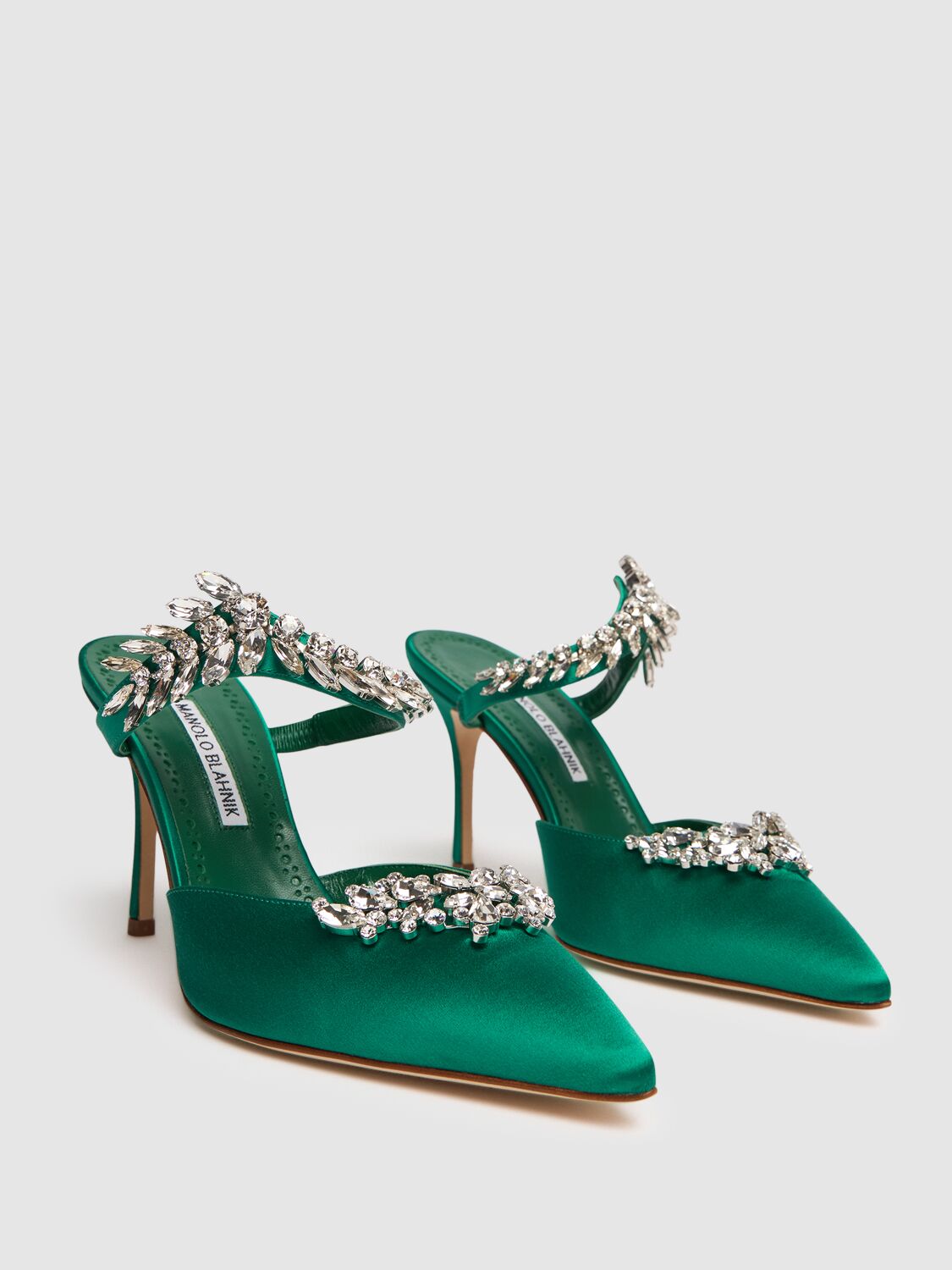 Elegant green mules with a thin heel