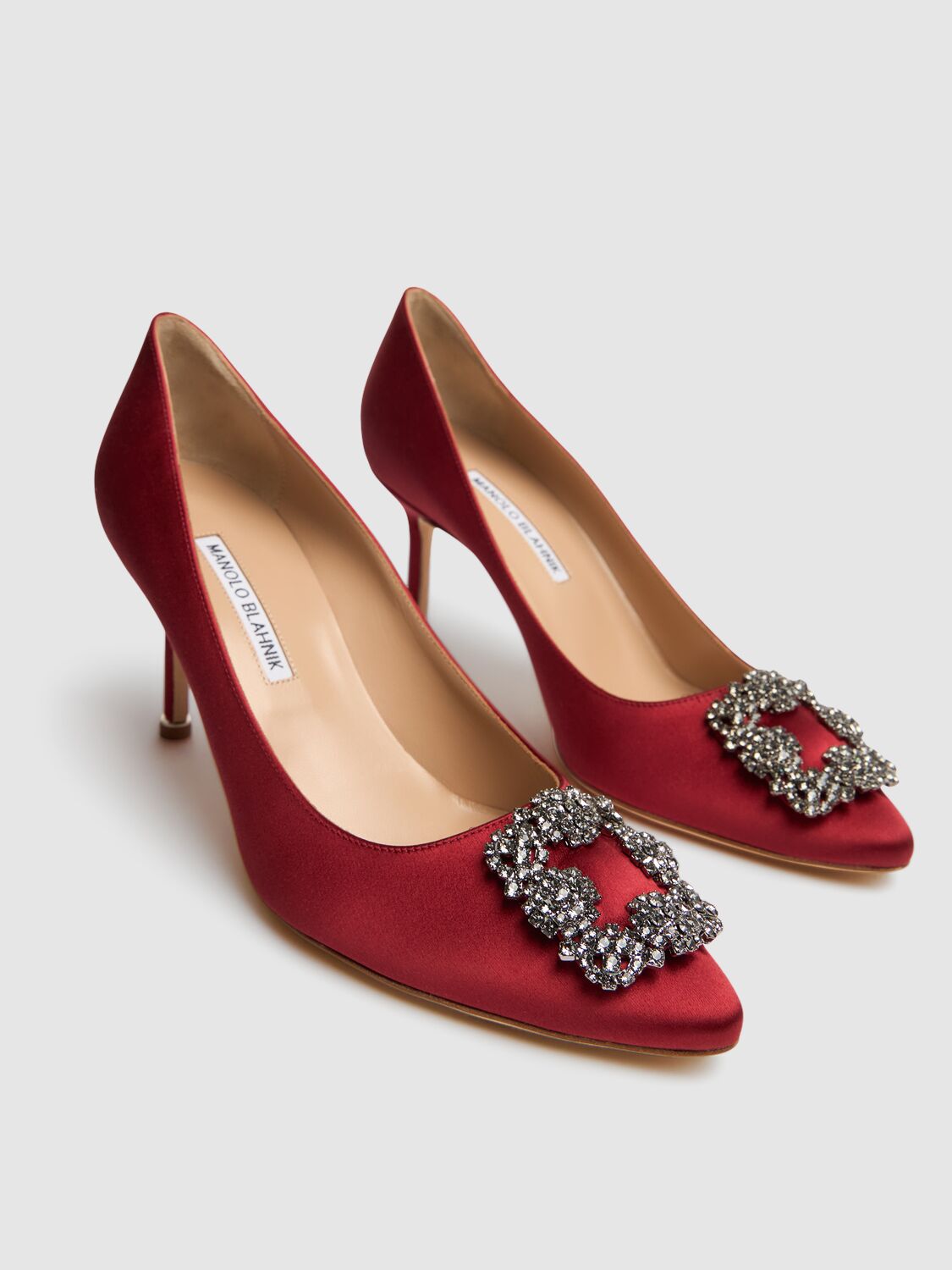 Elegant red décolleté shoe with high heel