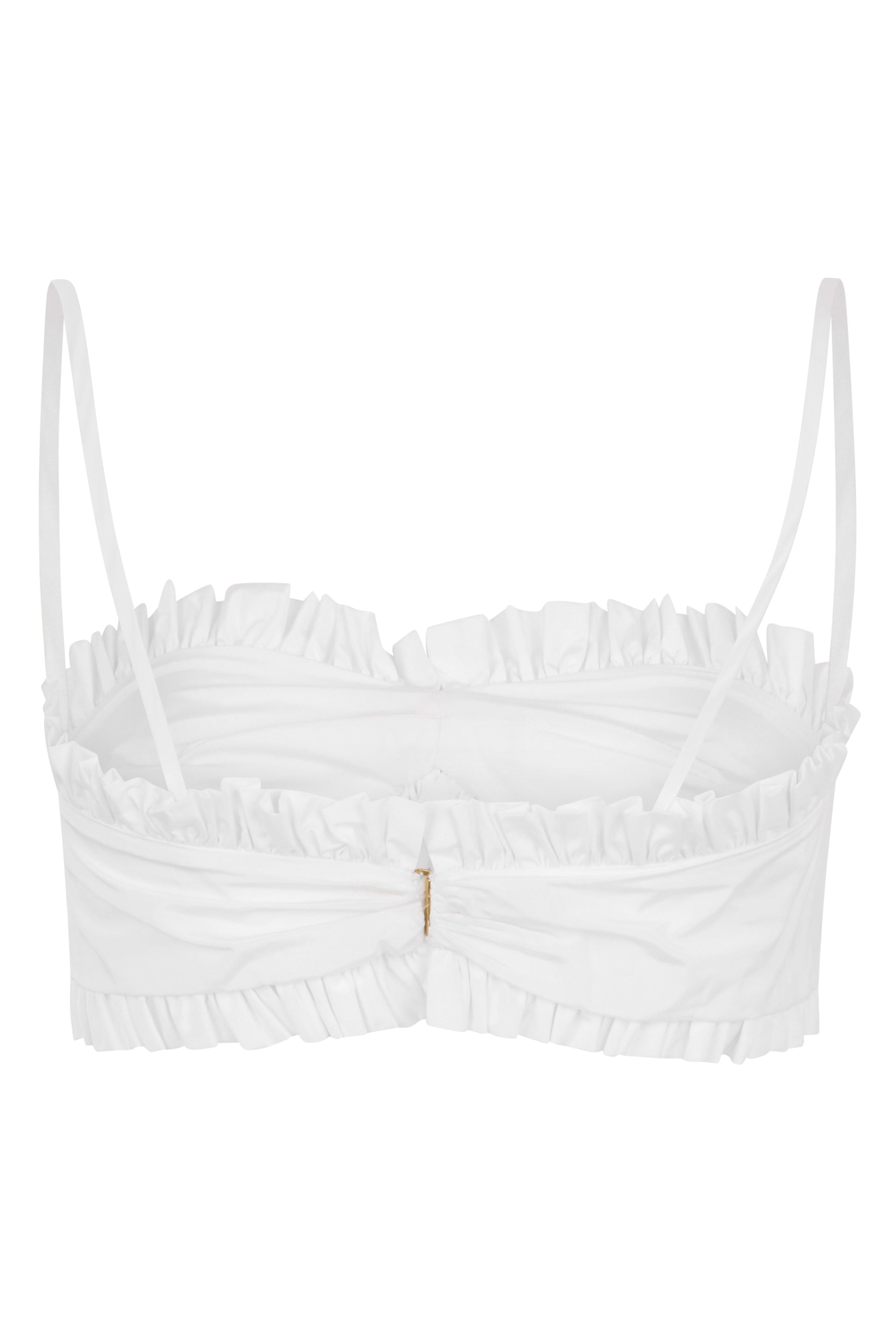 Short white top with thin straps and bow.