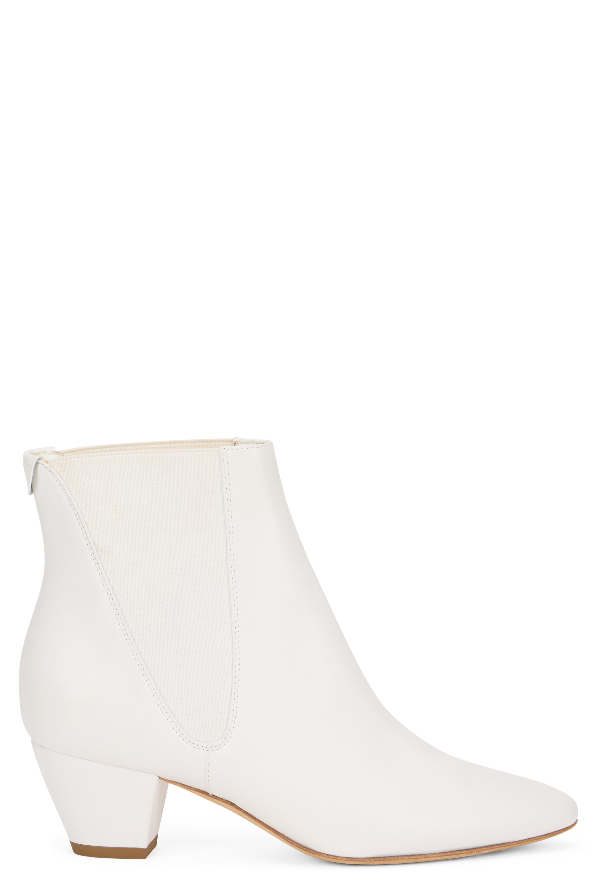 White ankle boot with elastic insert and low heel.