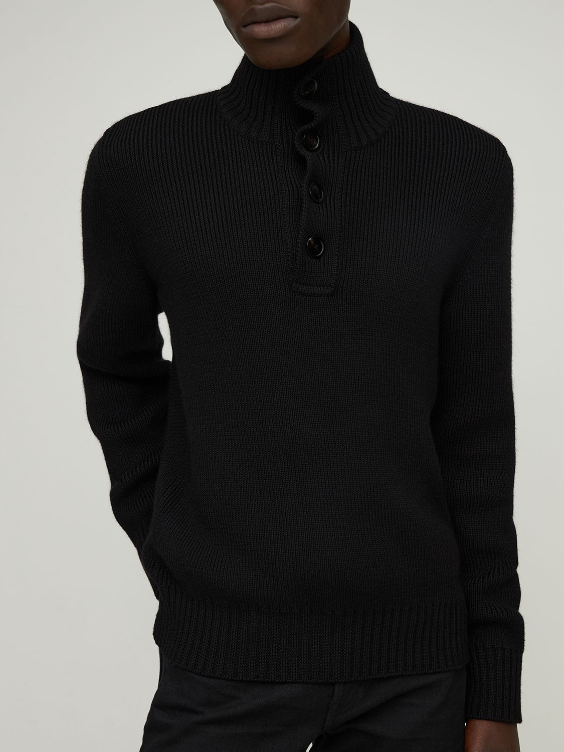 Black sweater with long sleeves and high collar