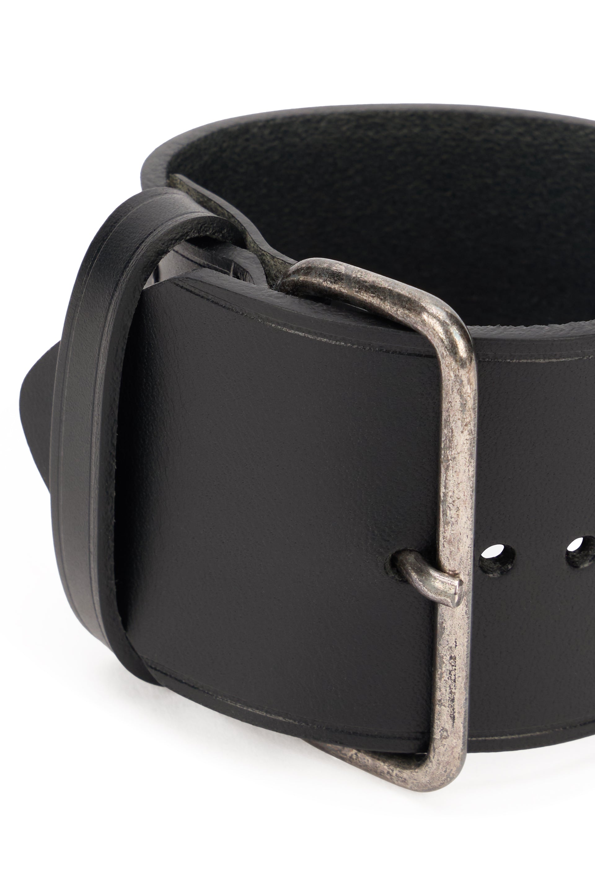 Elegant black bracelet with buckle closure.
