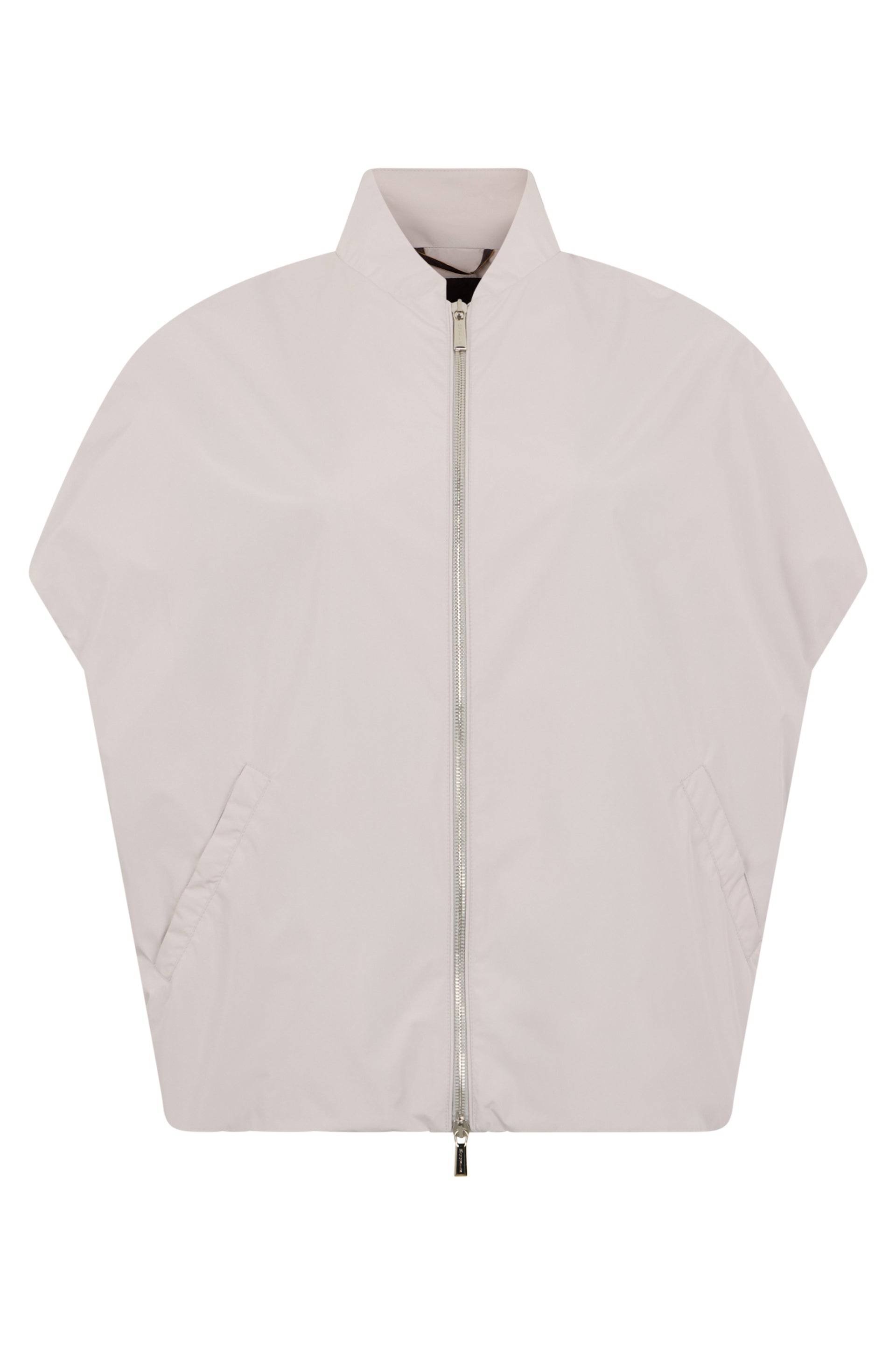 Cape in white cream color with oversized cut.
