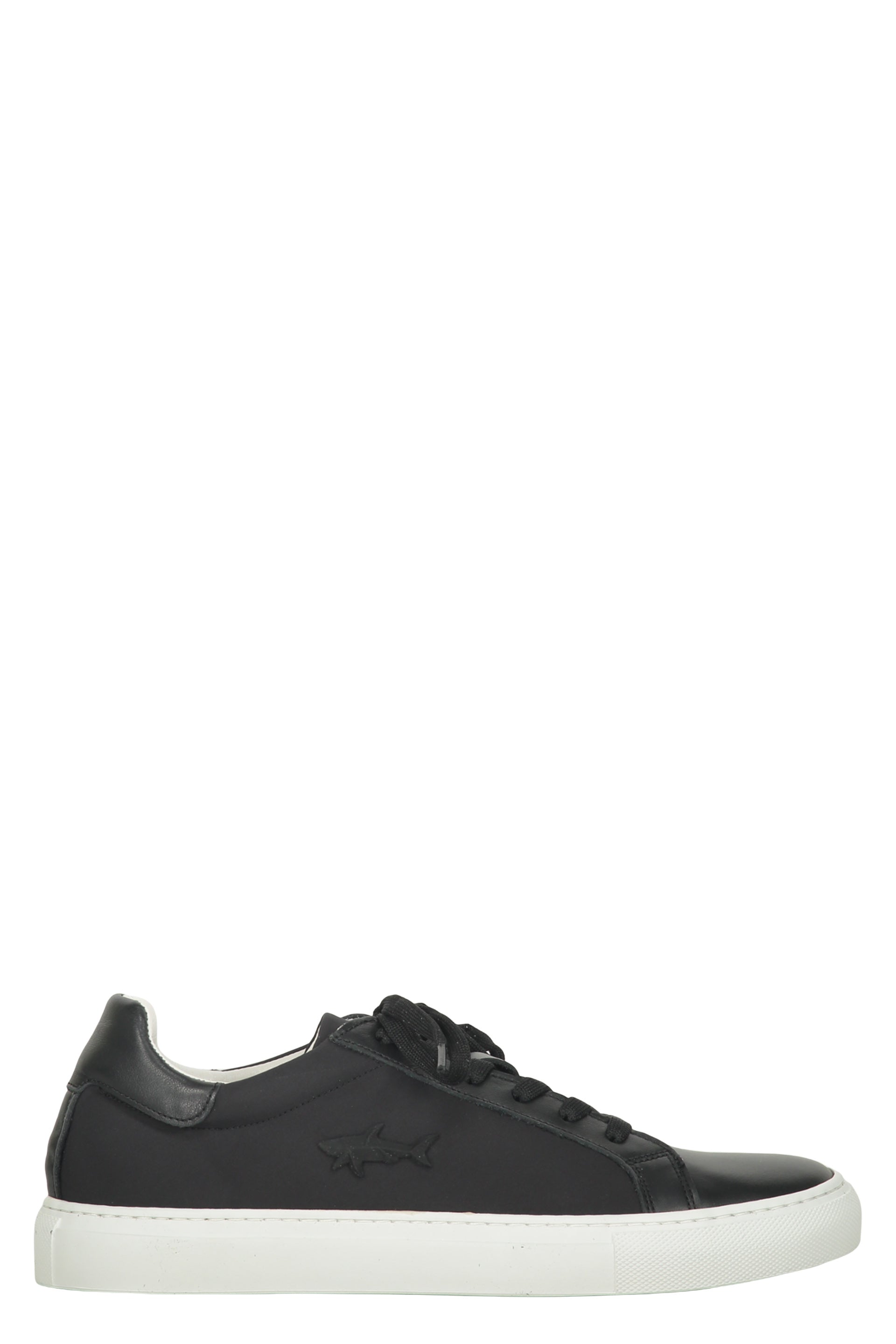 Modern black sneakers with a white sole