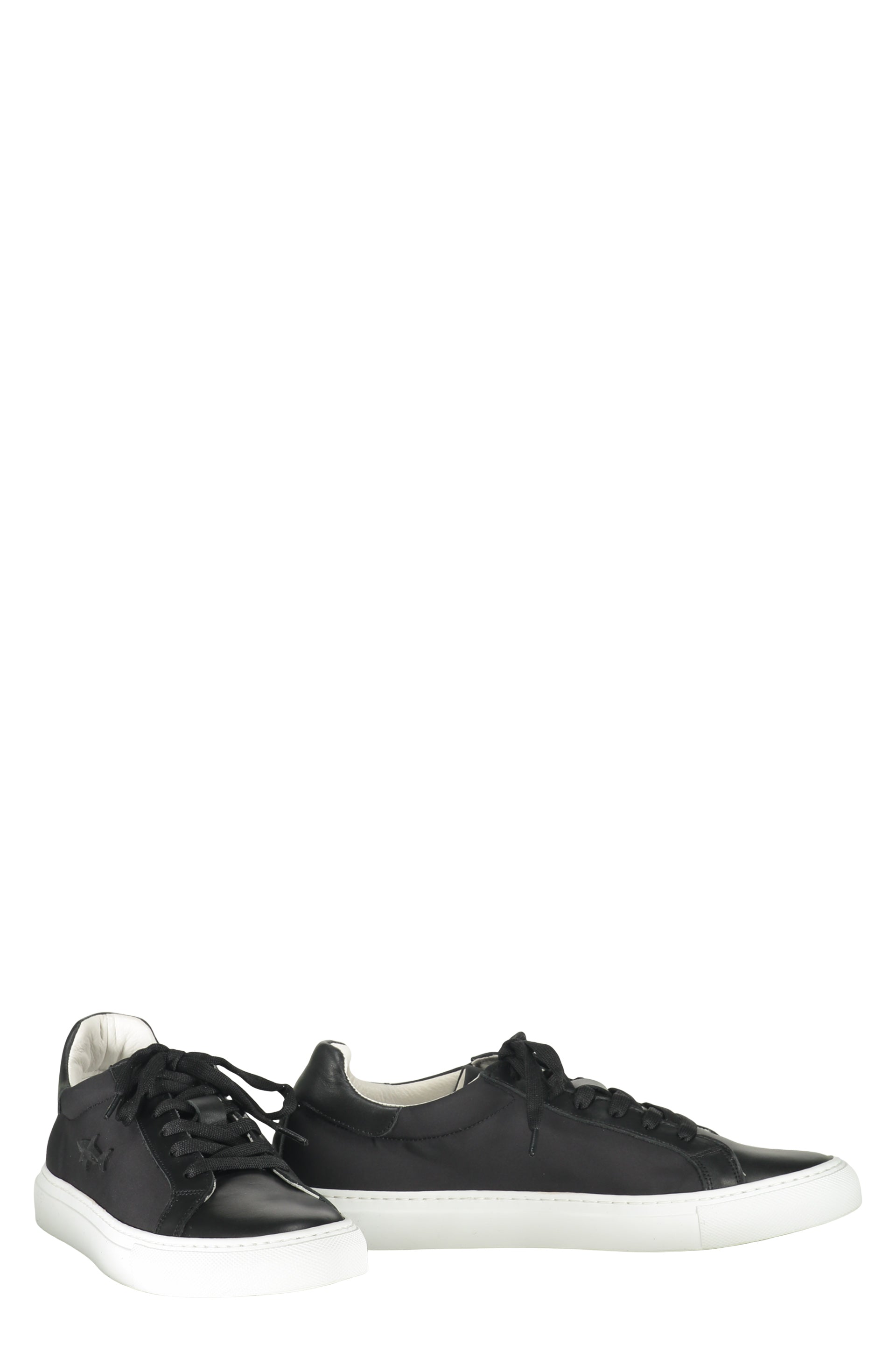 Modern black sneakers with a white sole