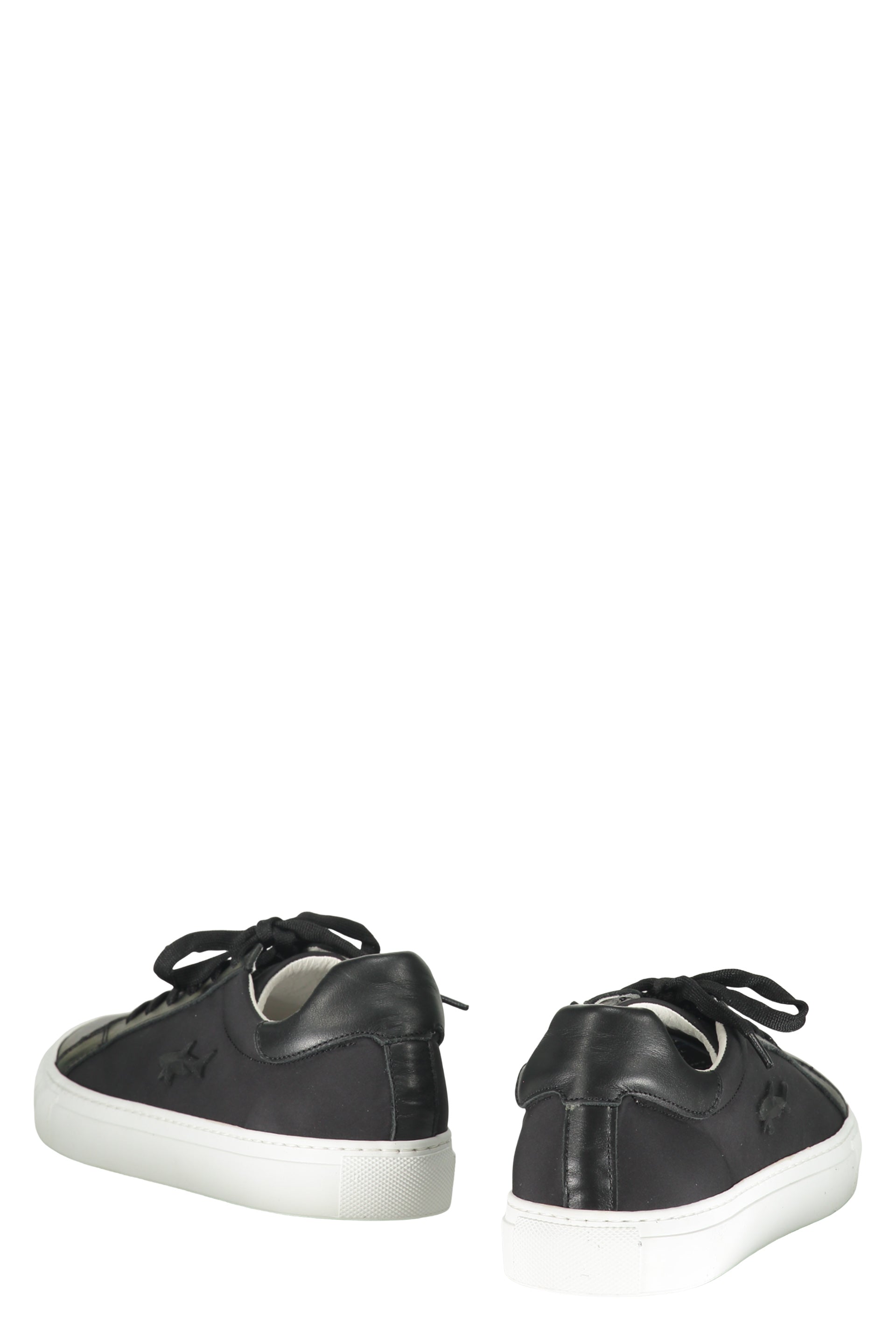 Modern black sneakers with a white sole