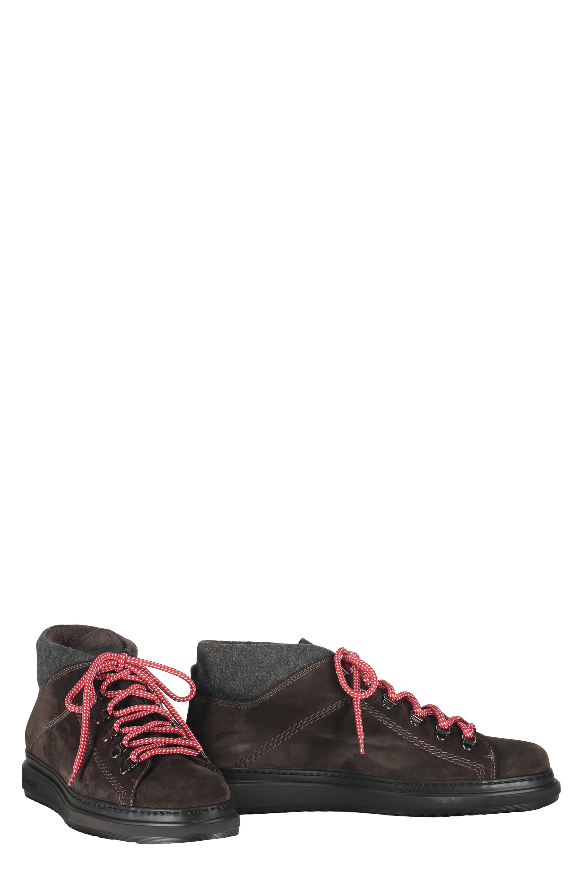 Brown high boots with modern red details