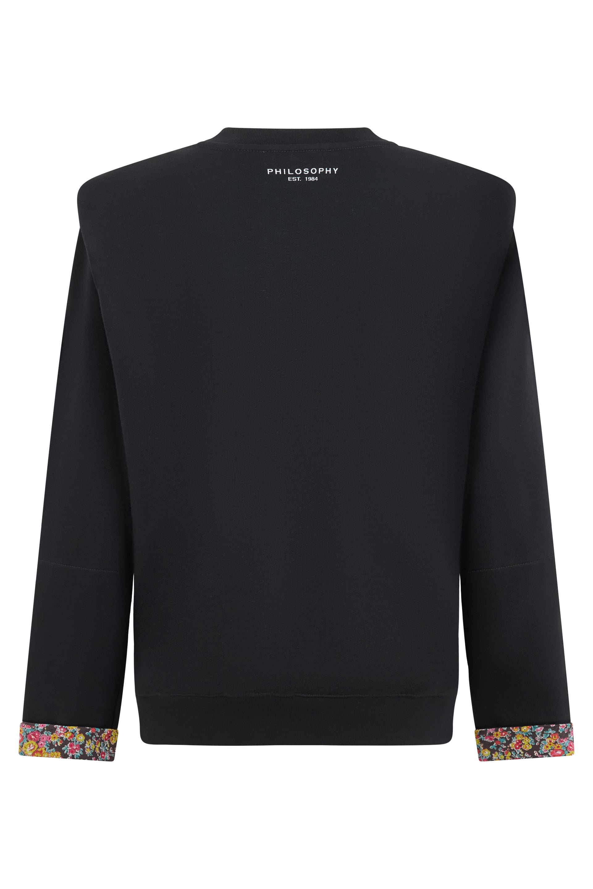 Versatile black crewneck sweatshirt with contrasting floral details.