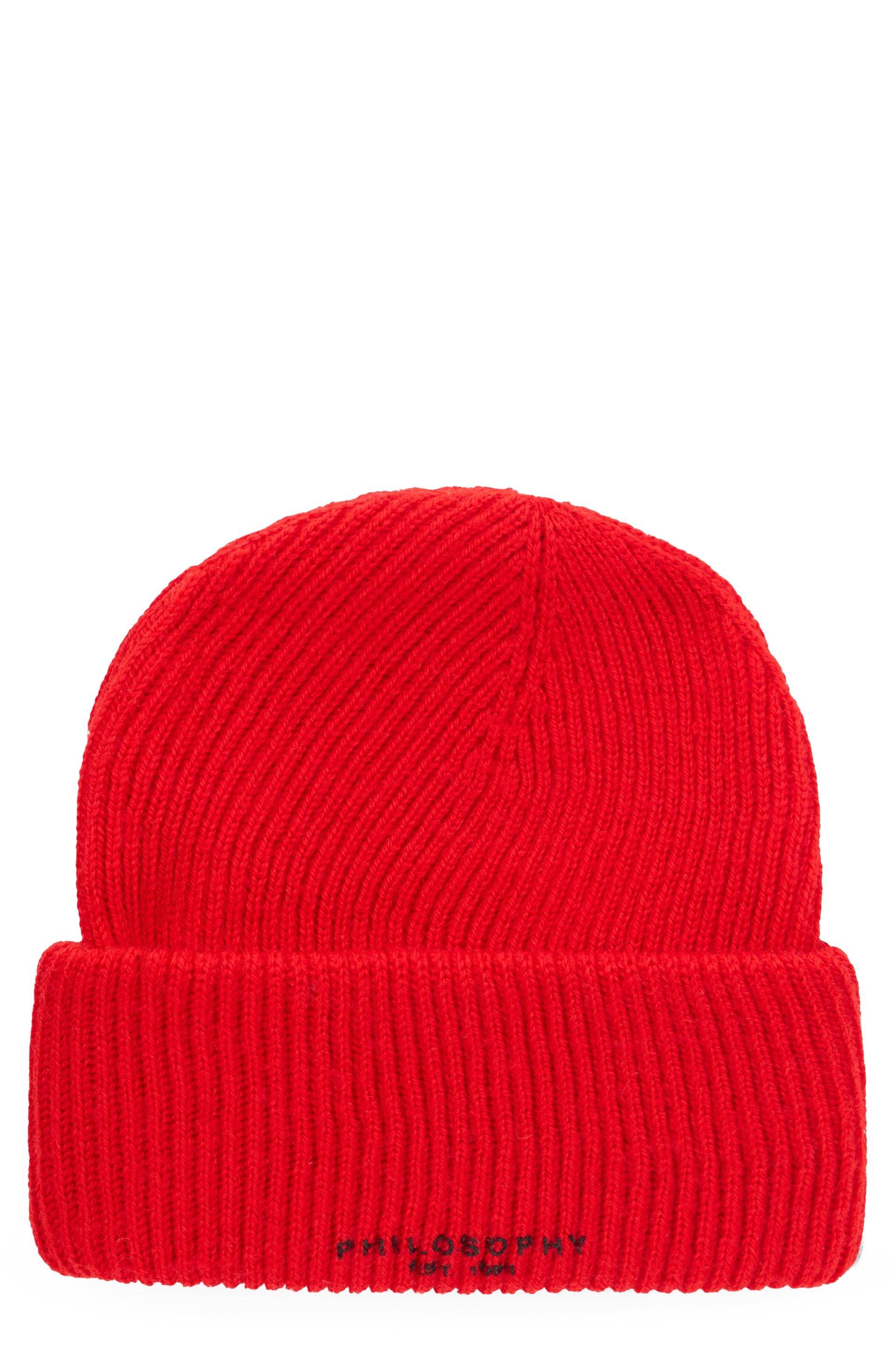 Red winter hat with colorful holiday writing.