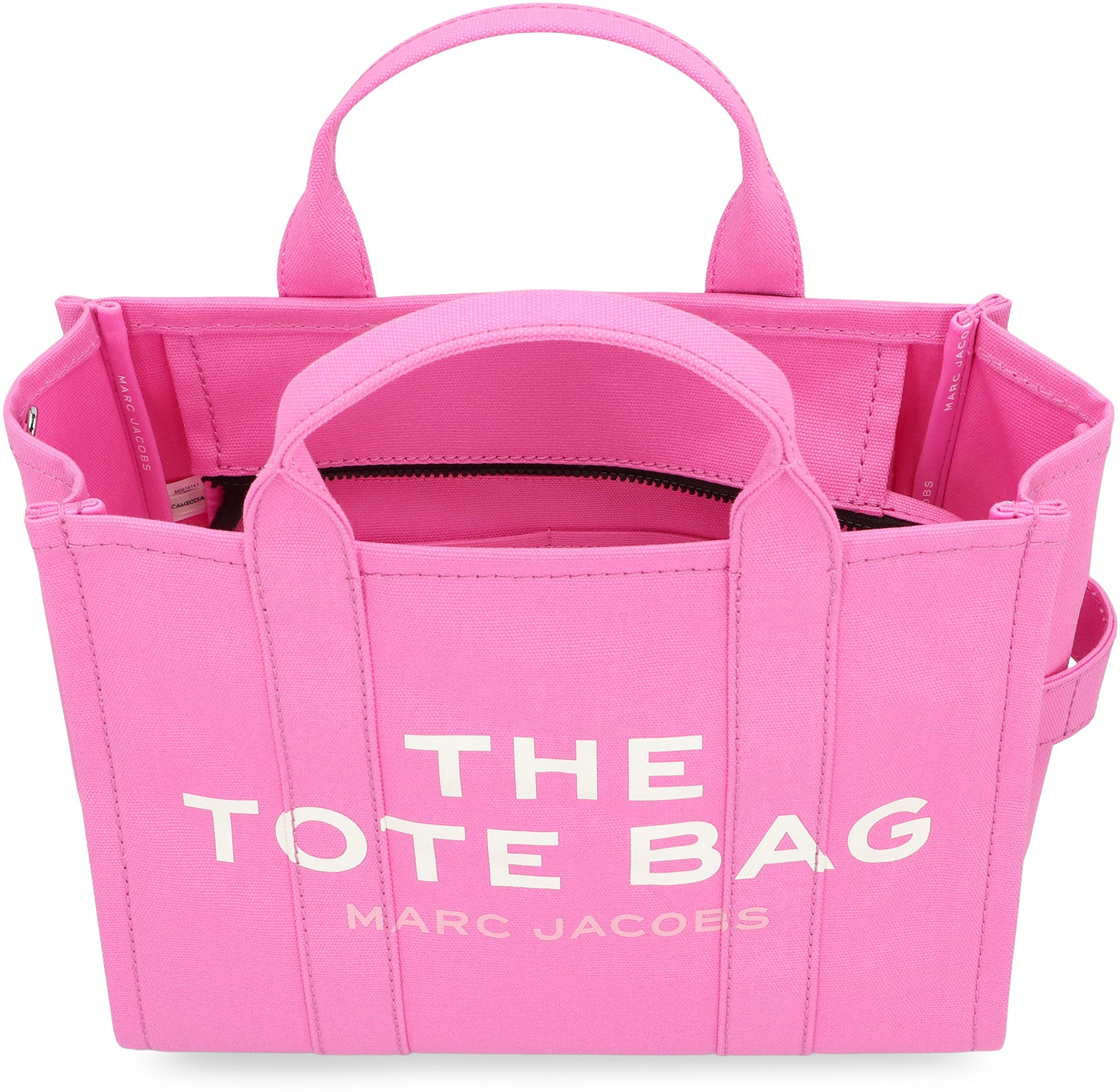 La traduzione di "The Canvas Medium Tote Bag" dall'inglese (EN) all'italiano (IT) è: La borsa a spalla in tela.