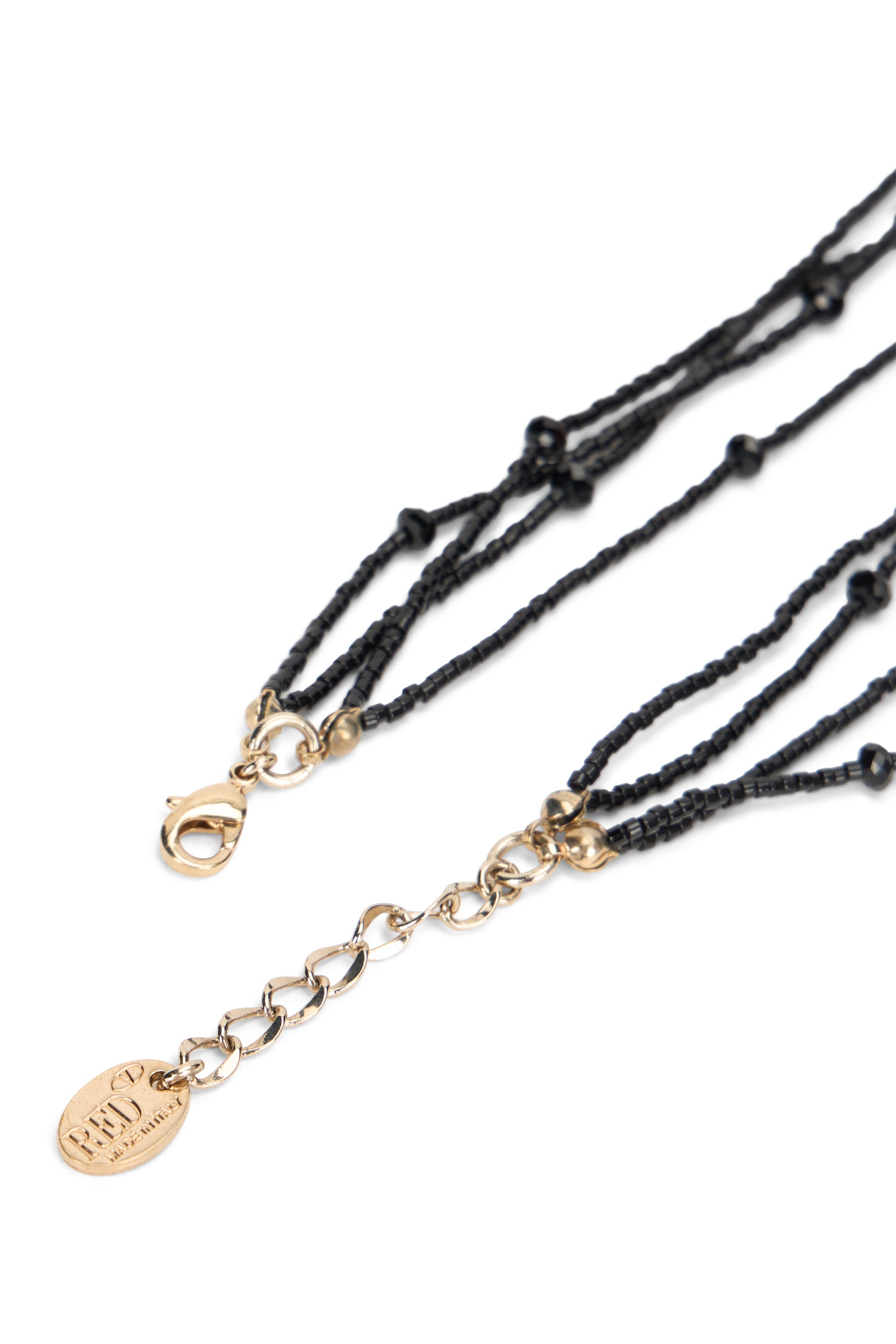 Elegant black multi-layer necklace with beads and pendants.