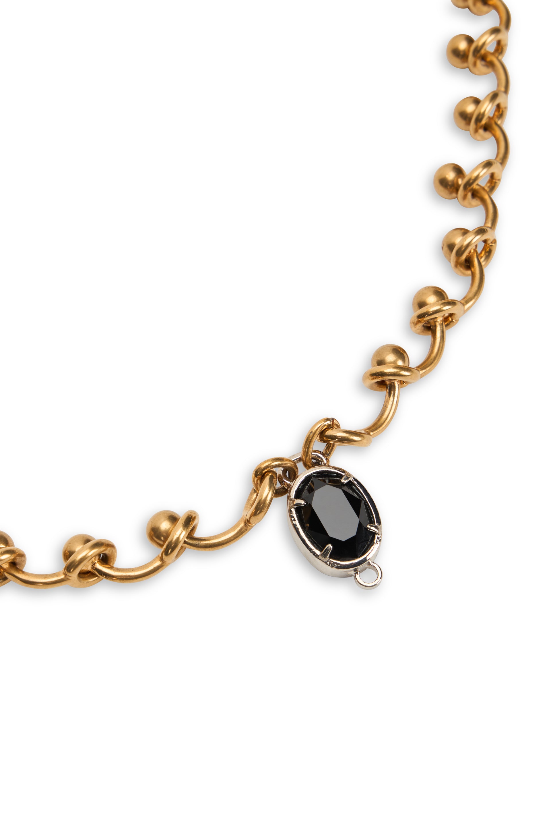 Elegant gold necklace with black stone.