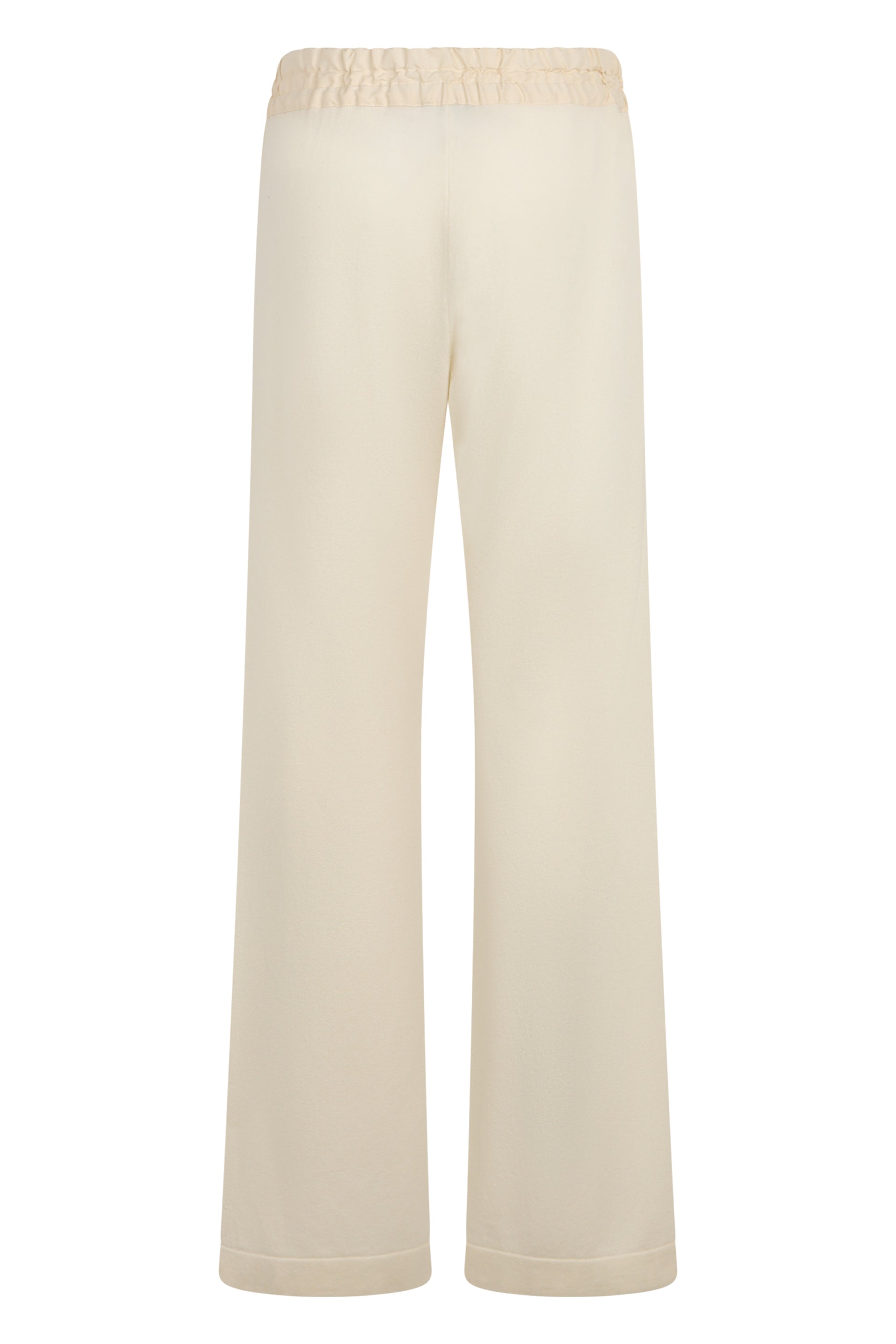 Long sand-colored trousers, elegant and versatile.
