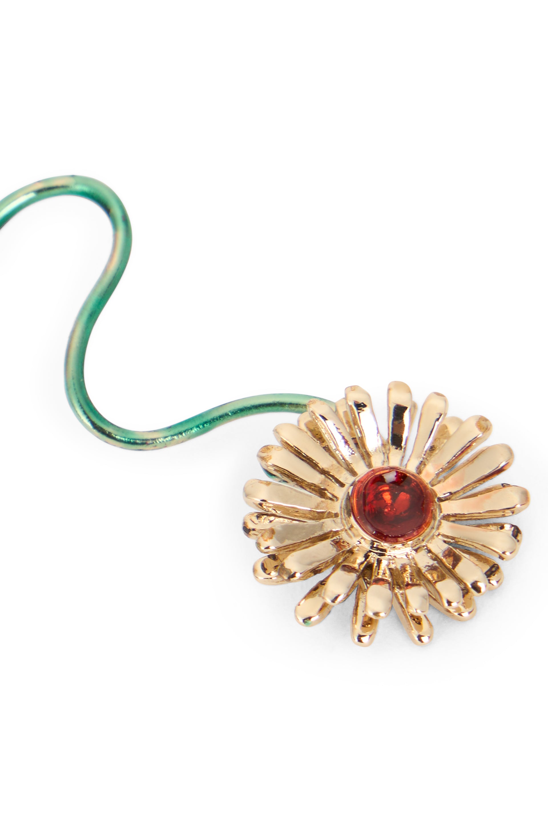 Circular gold-colored pendant elegant with flower.