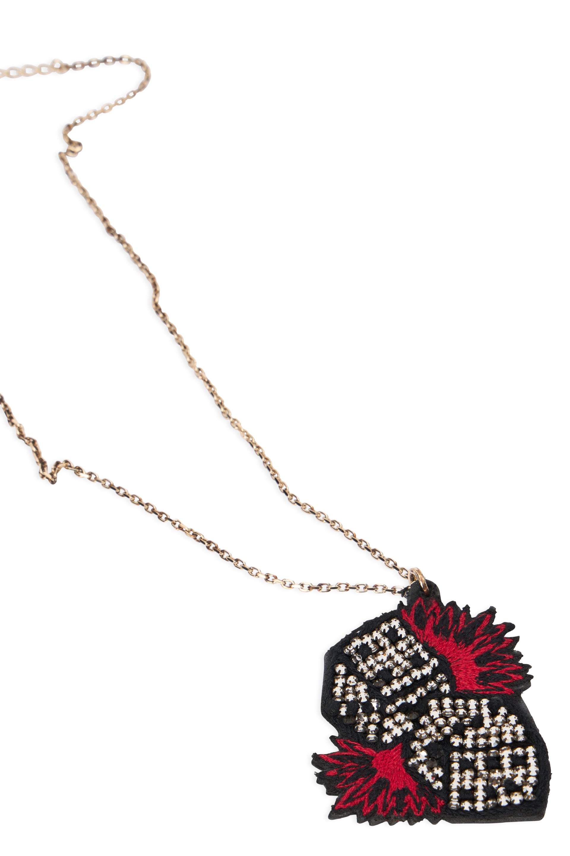 Elegant gold necklace with artistic red pendant.
