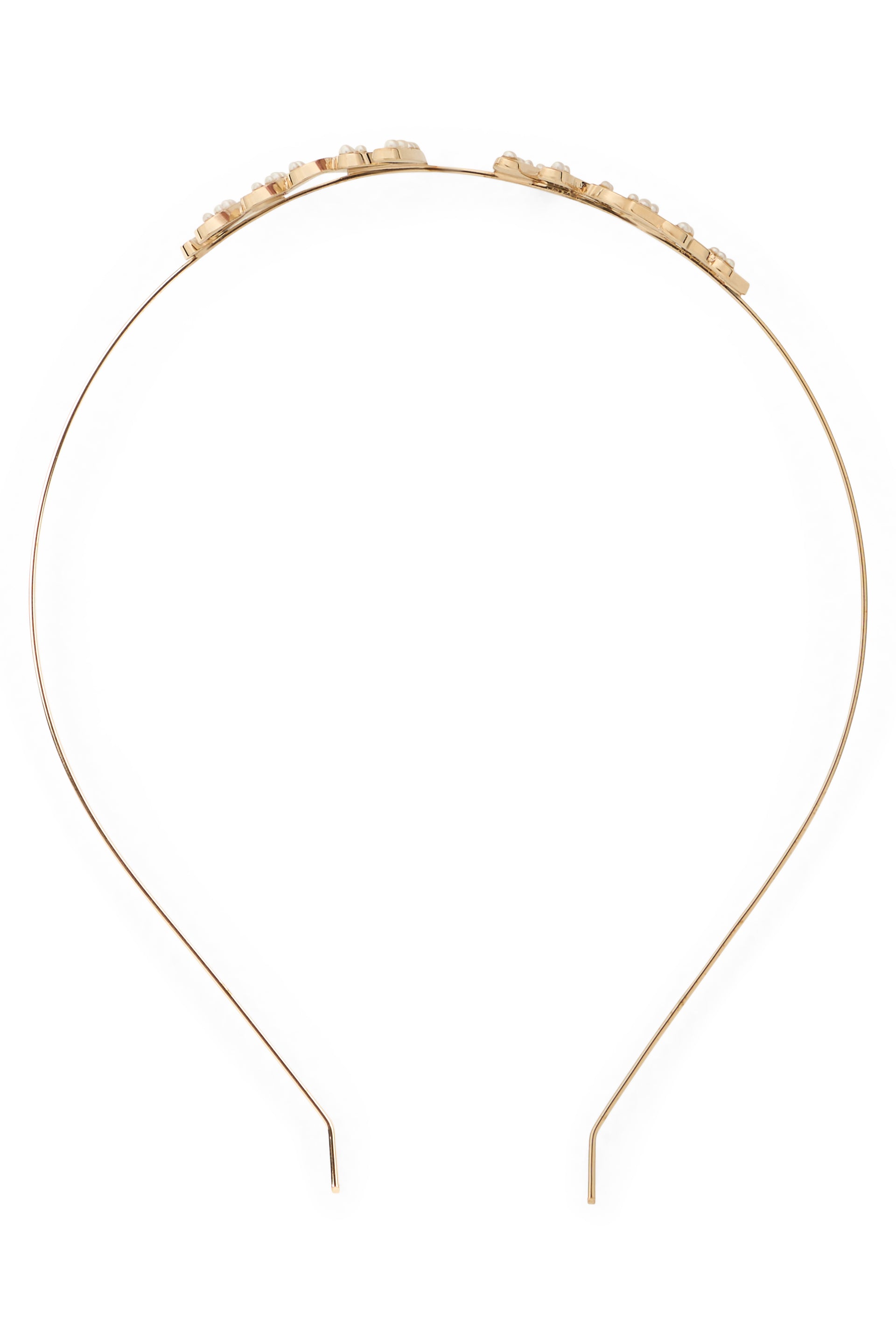 Elegant metal hairband in shiny gold color.