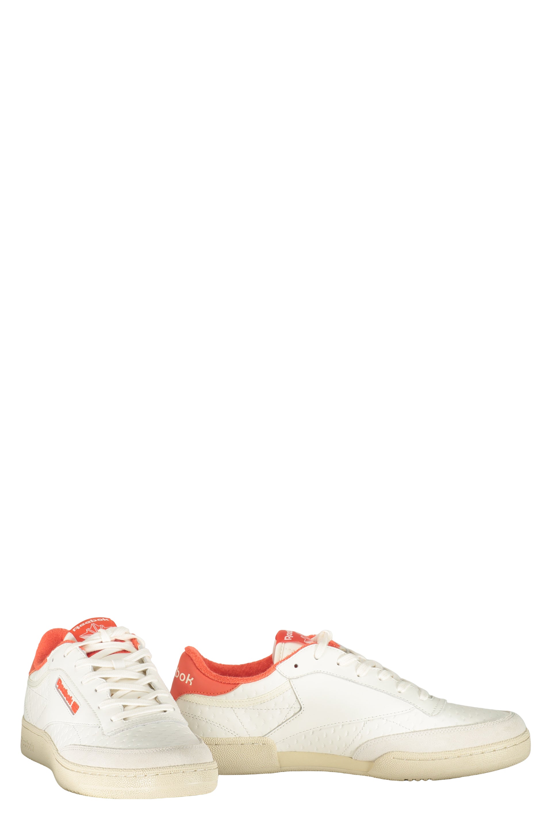 White sneakers with orange details