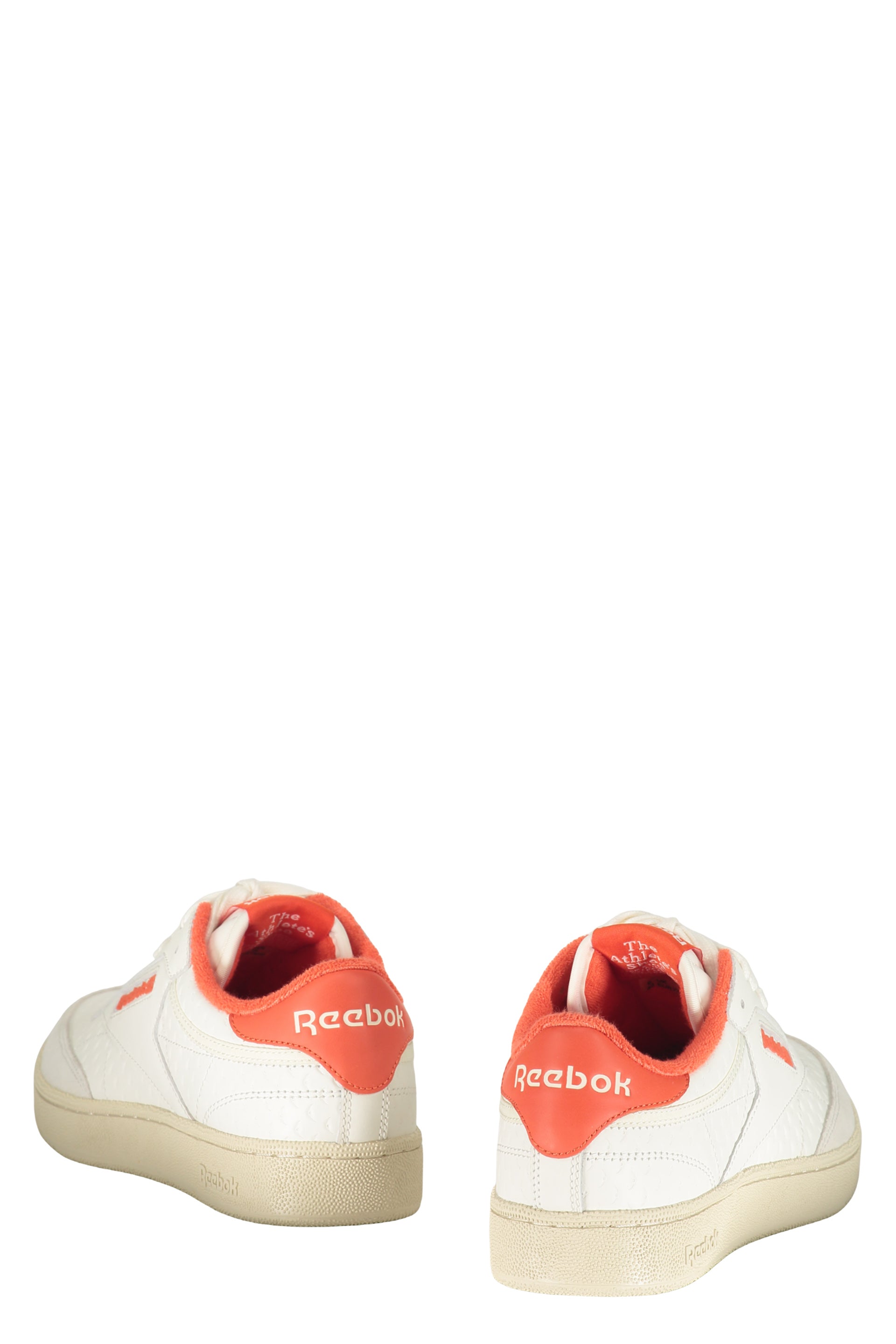 White sneakers with orange details