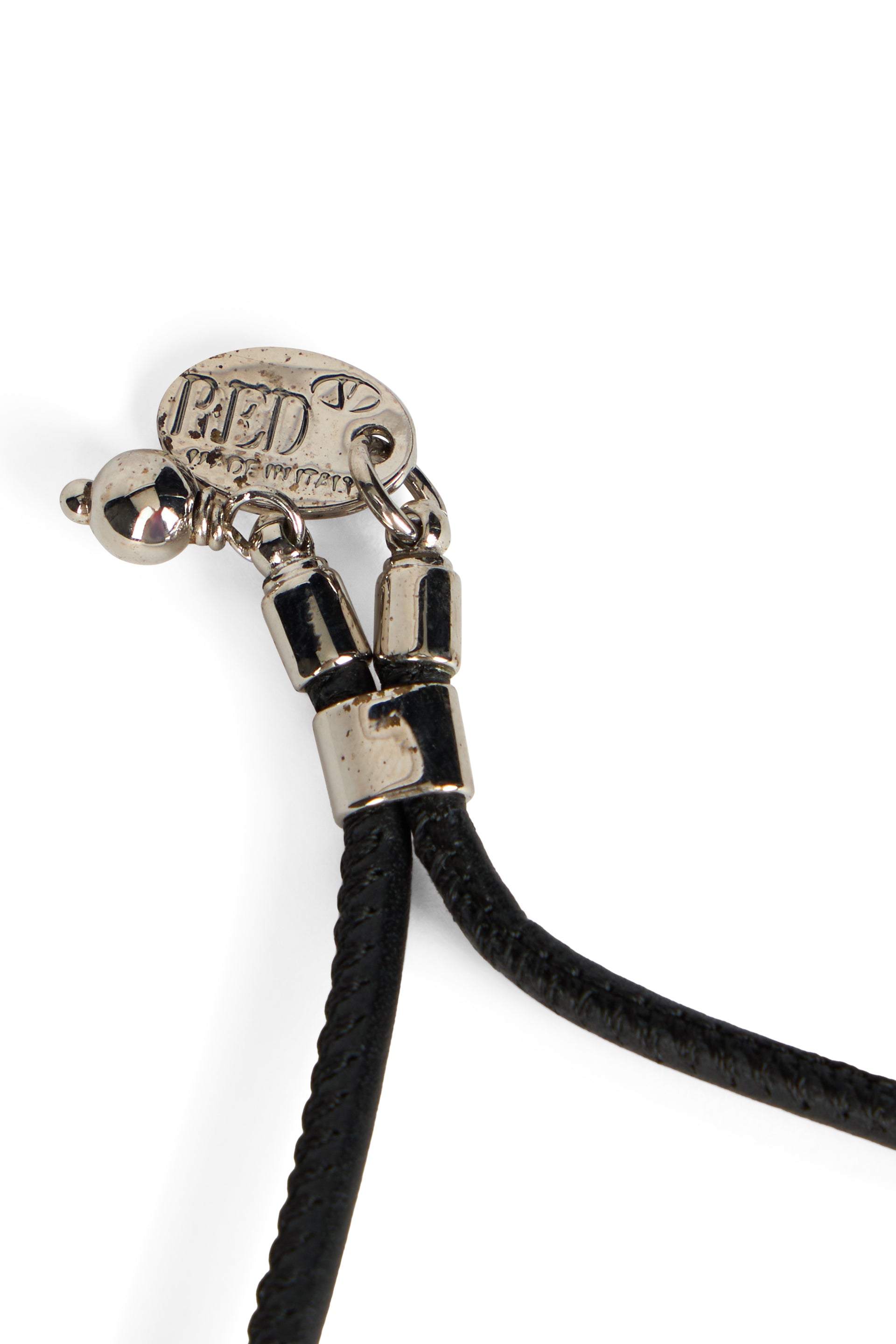 Modern metal bracelet with elegant black cord.