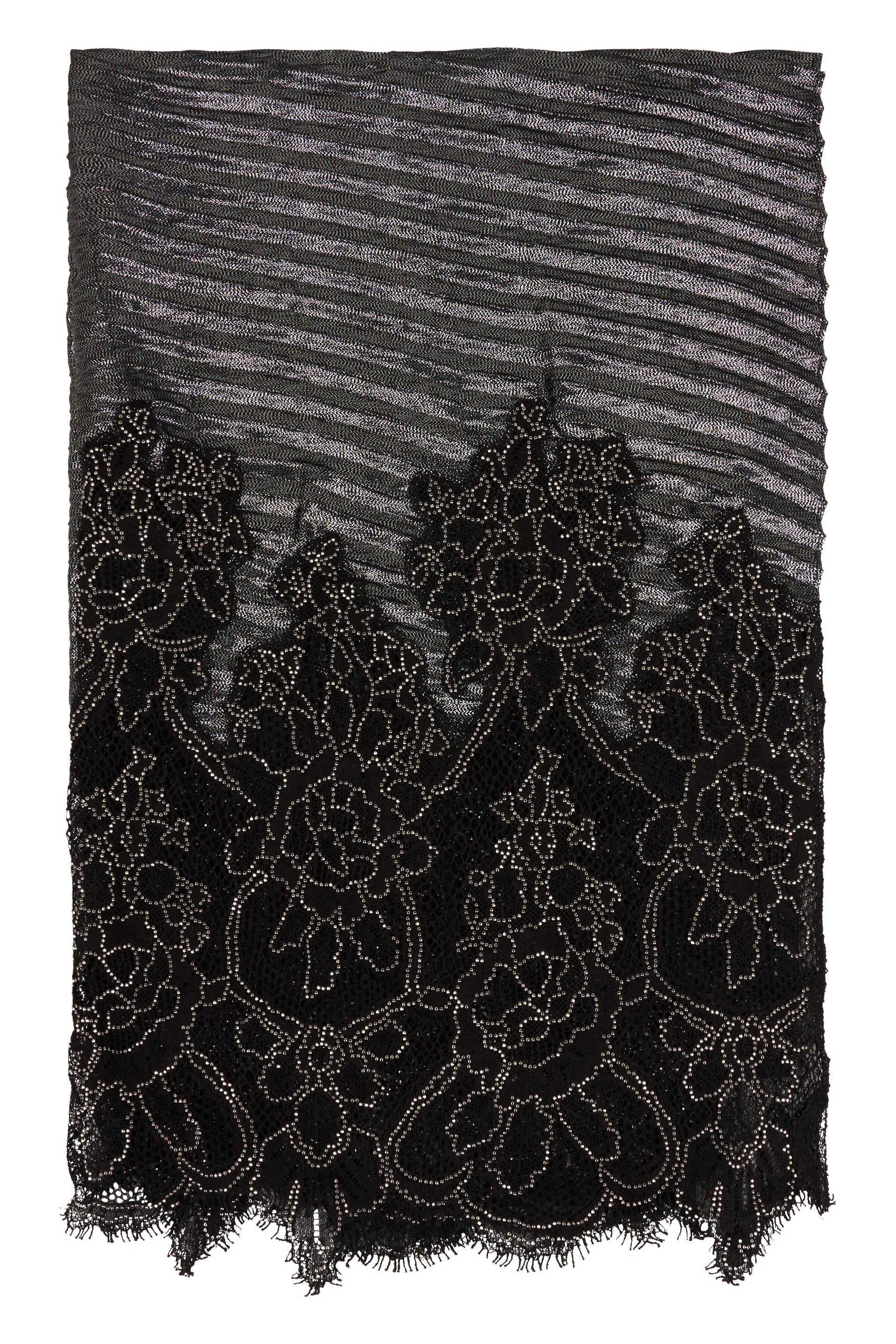 Black skirt with details of transparencies and rhinestones.