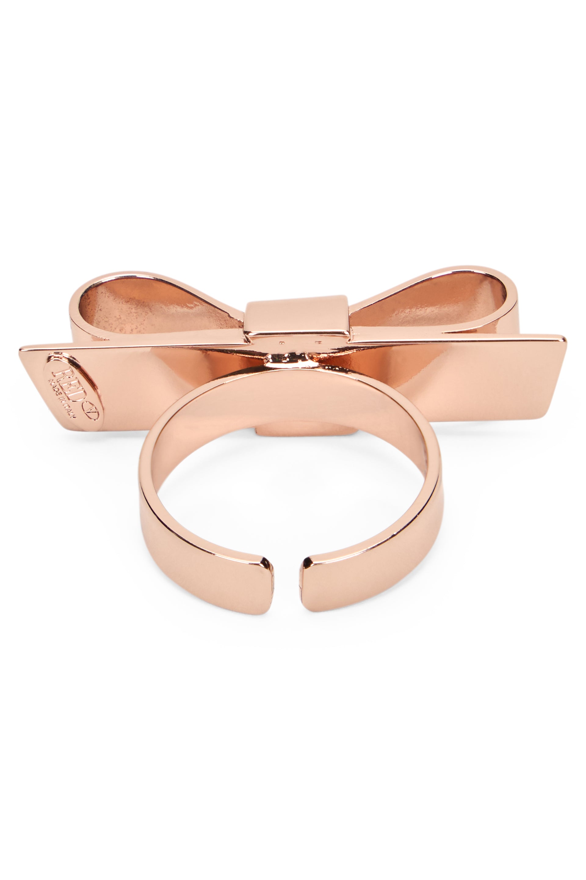 Elegant pink ring with bow from modern and refined design.