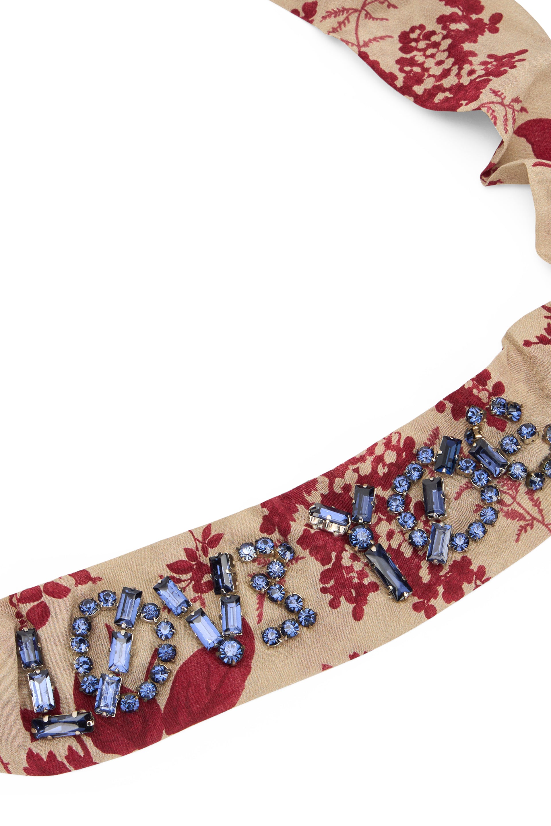 Beige headband with floral pattern in elegant and versatile fabric.