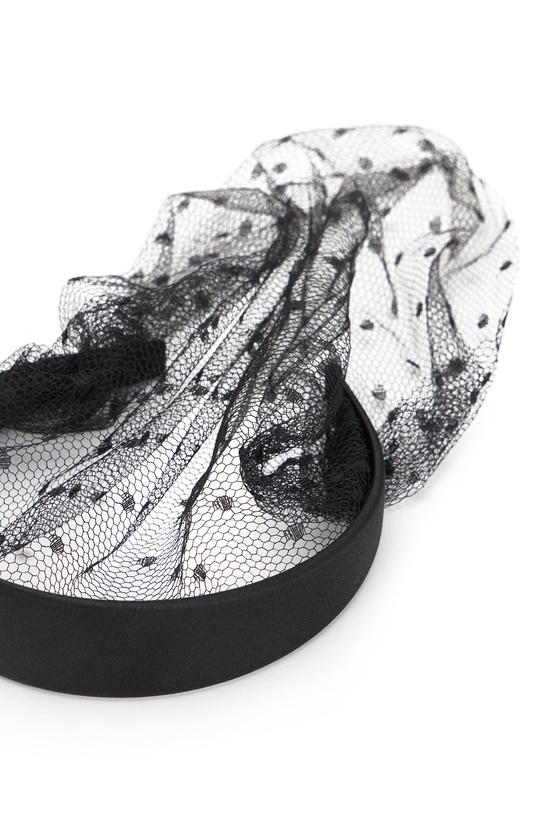 Elegant black hairband with decorative net.