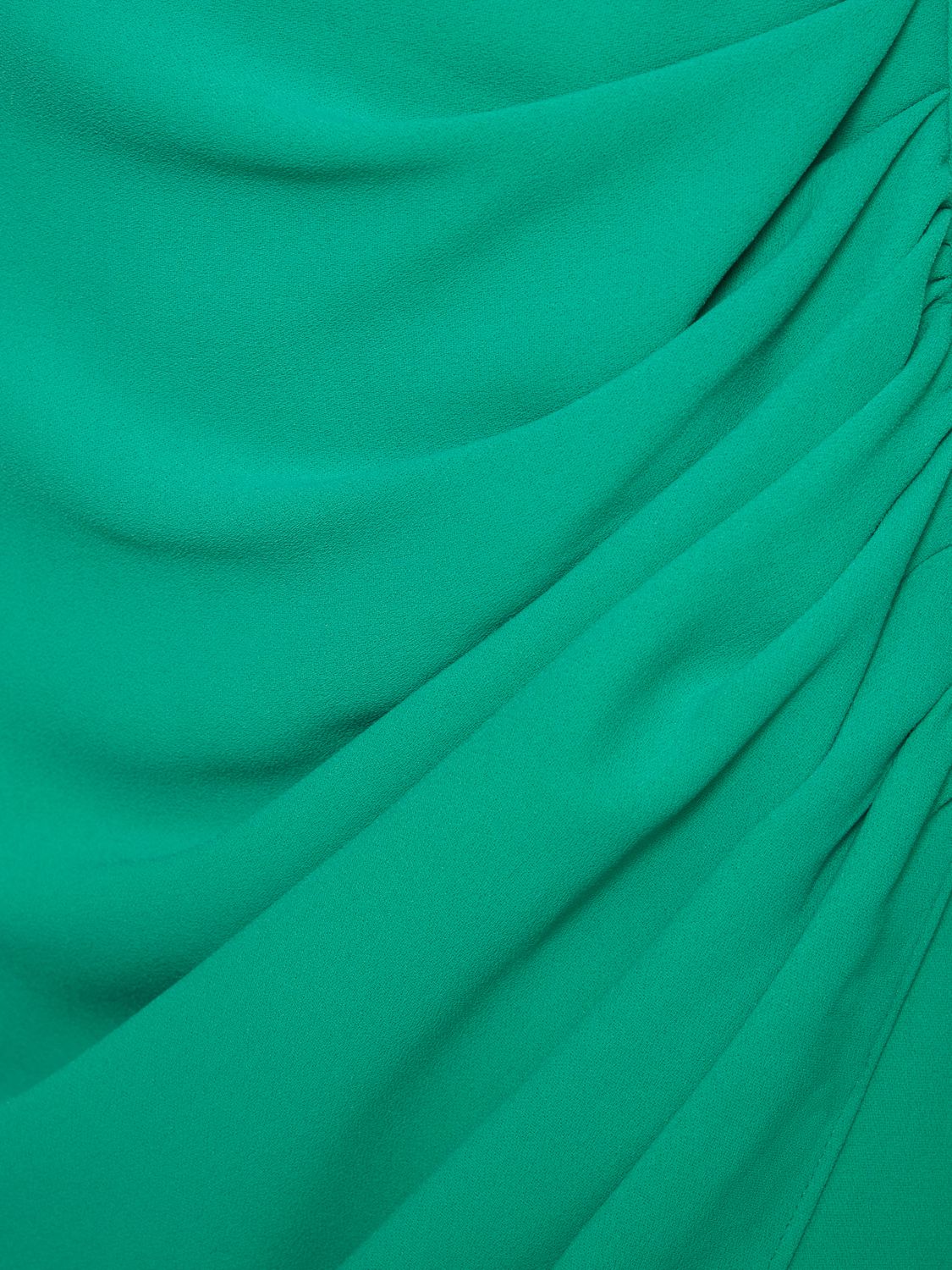 Long green elegant dress with sophisticated draping