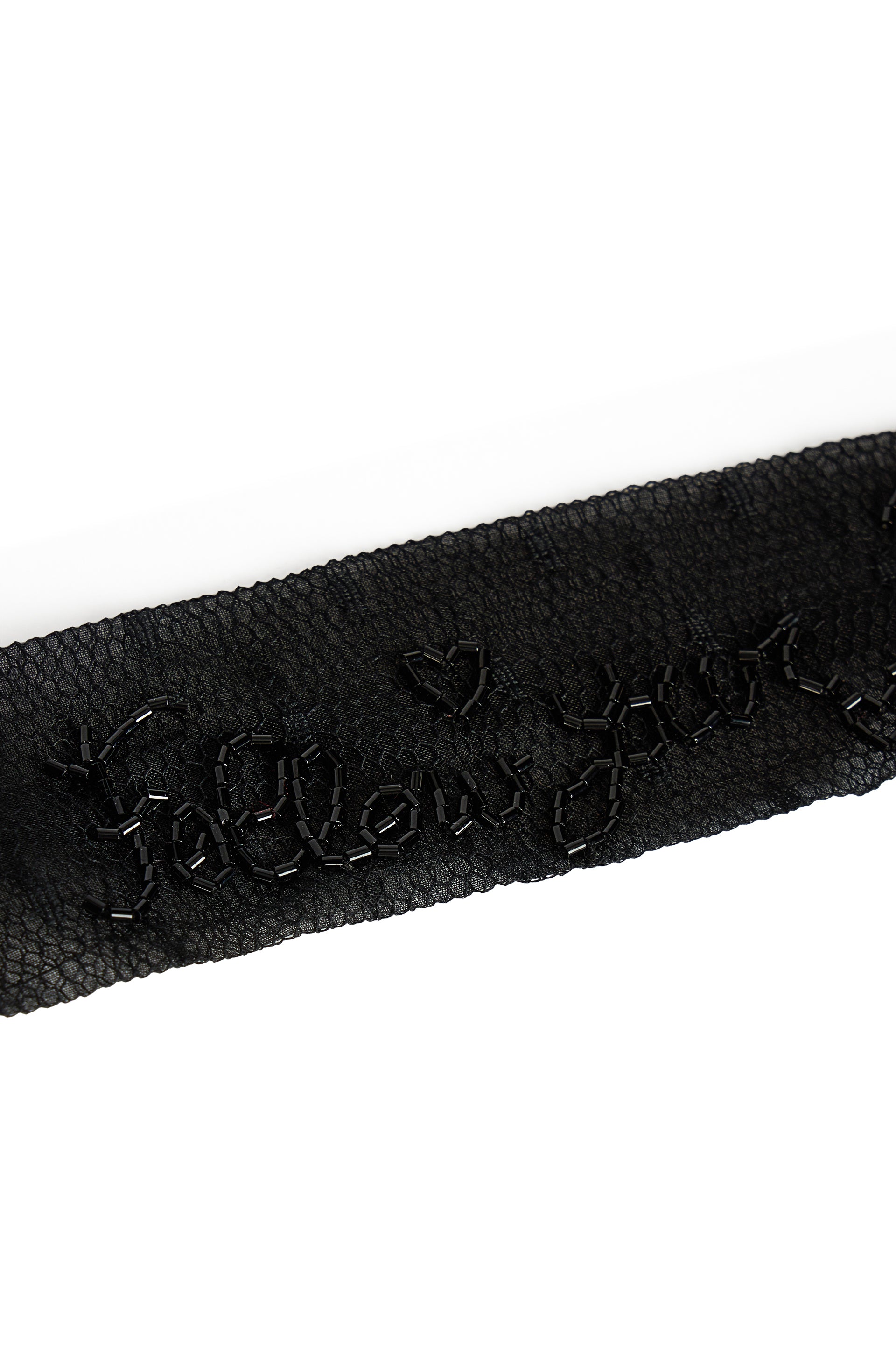 Black hairband with decoration, elegant and versatile.