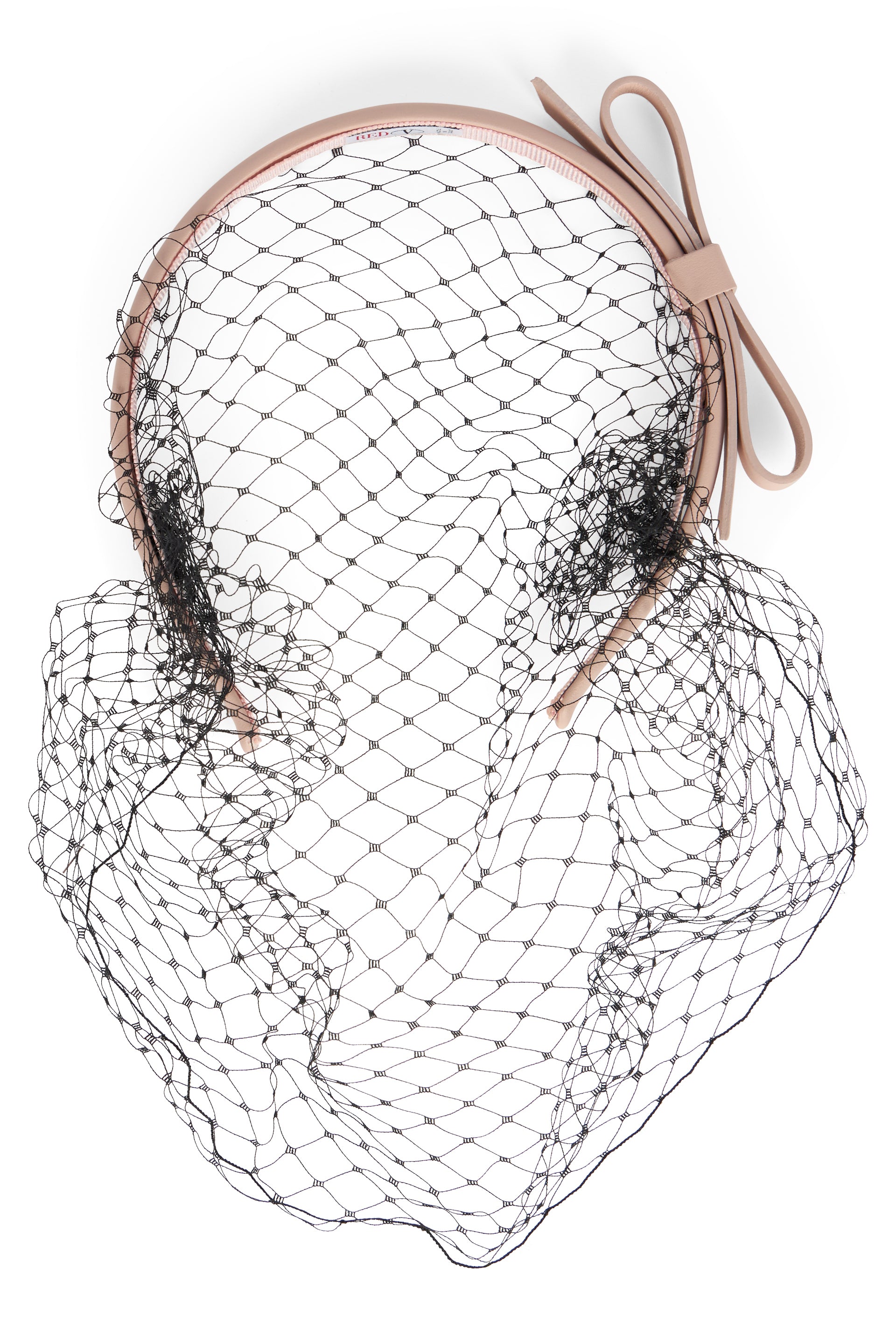 Beige headband with black net.