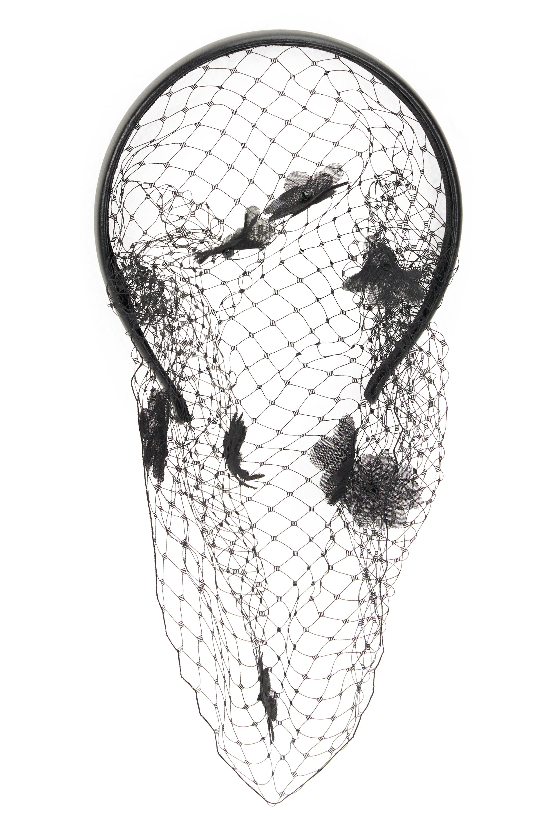 Black headband with net and fabric flower applications.