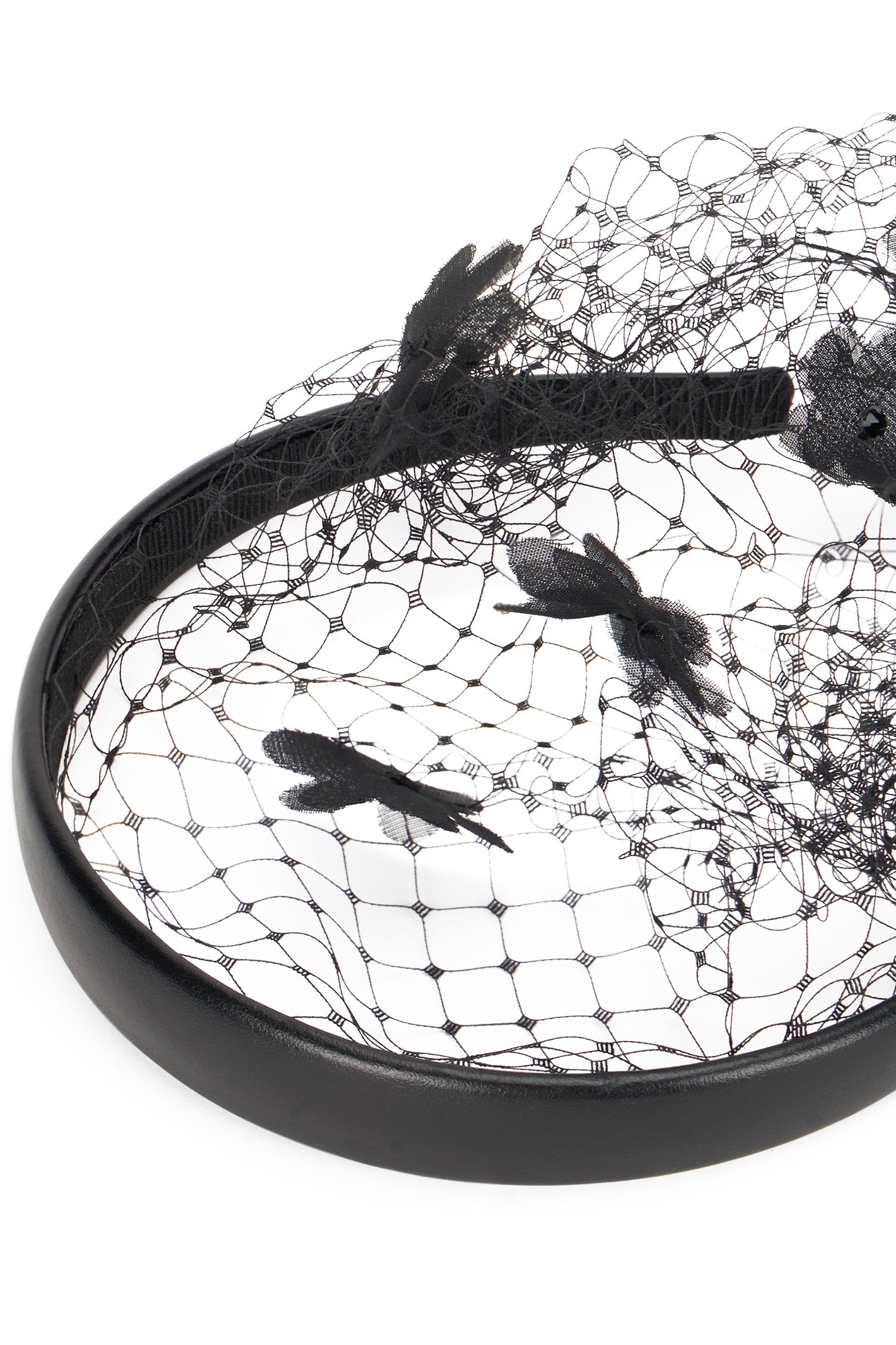 Black headband with net and fabric flower applications.