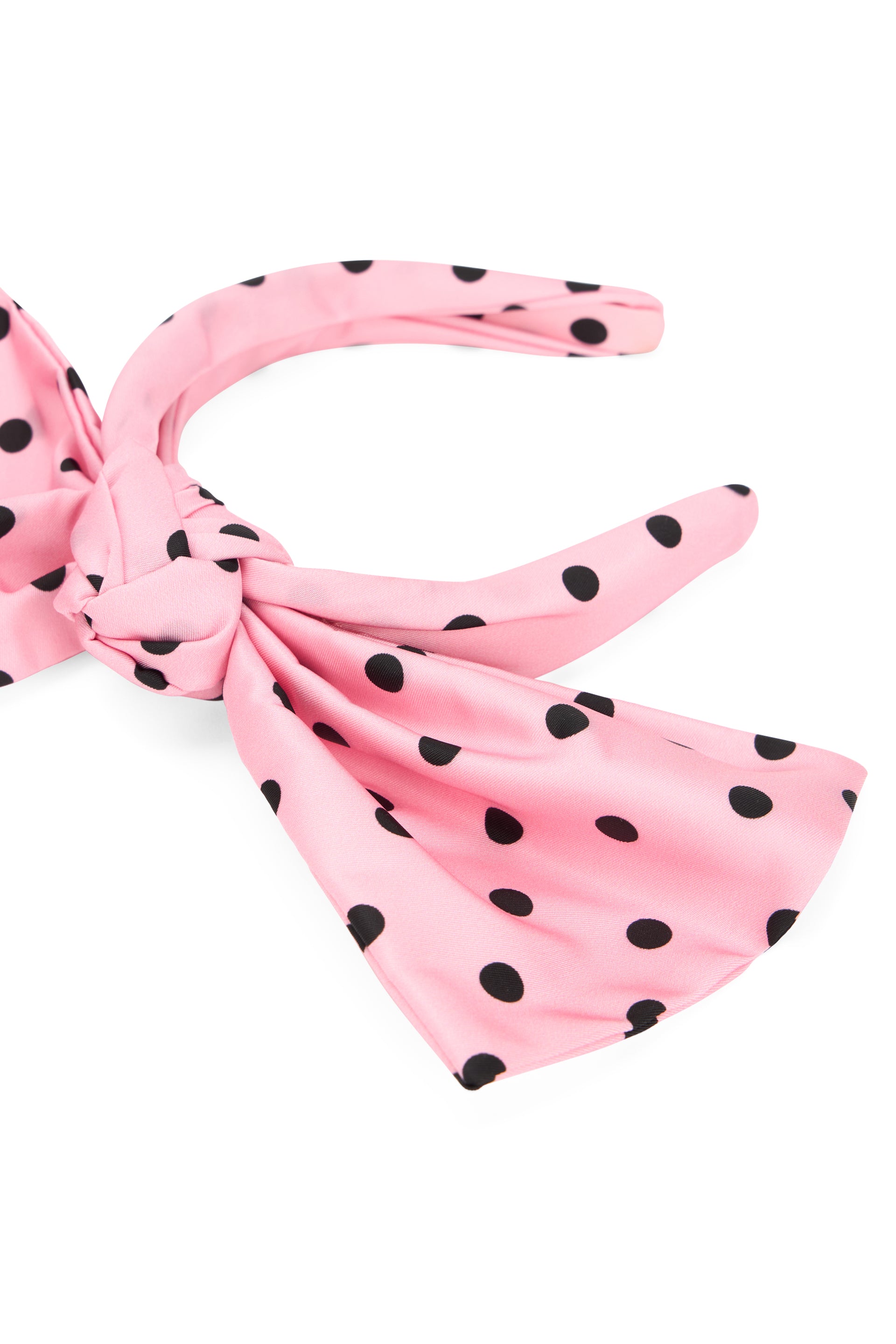 Pink hairband with black polka dot bow.