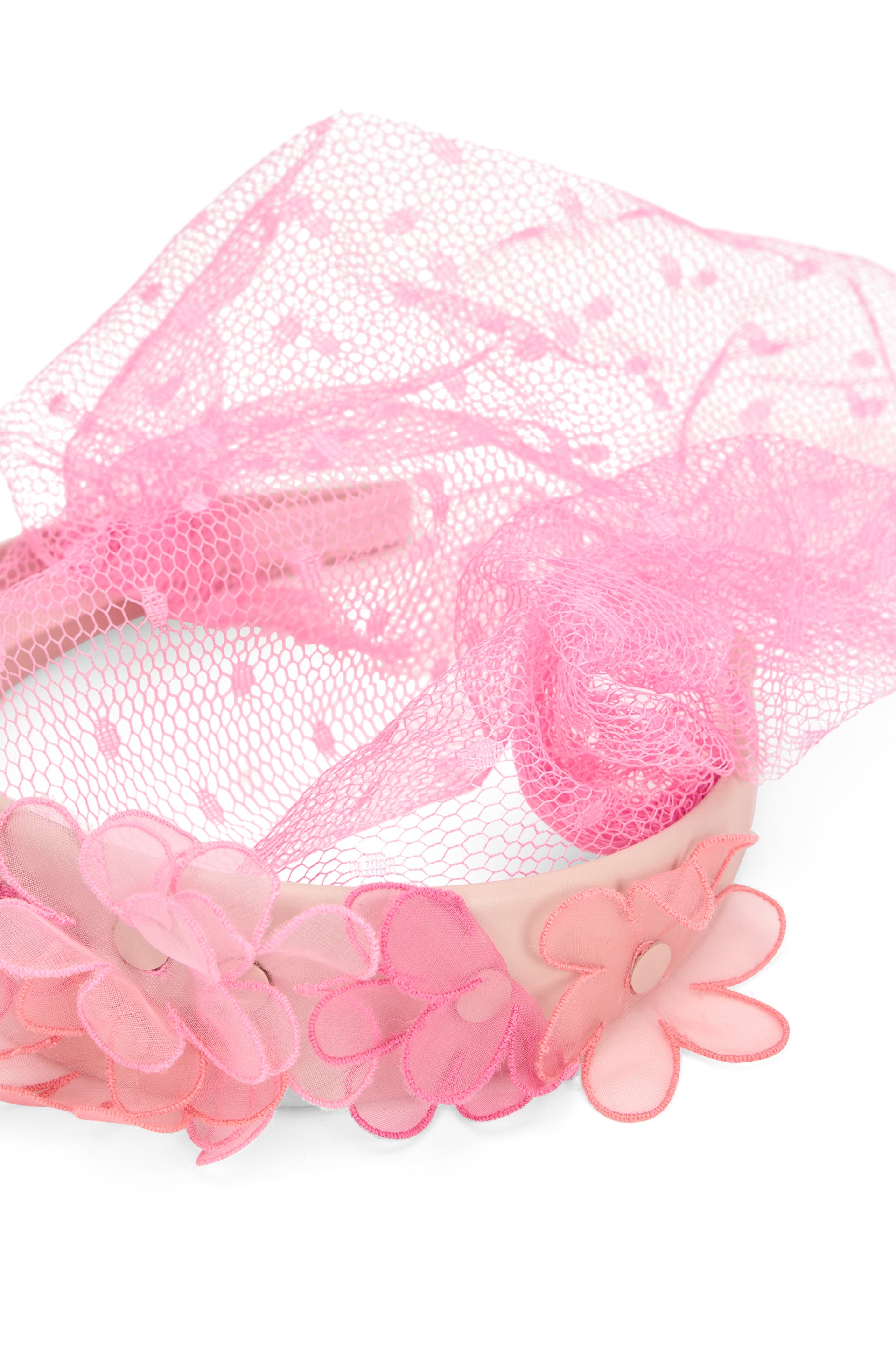 Hair accessory with a pink tulle veil with floral ornament.