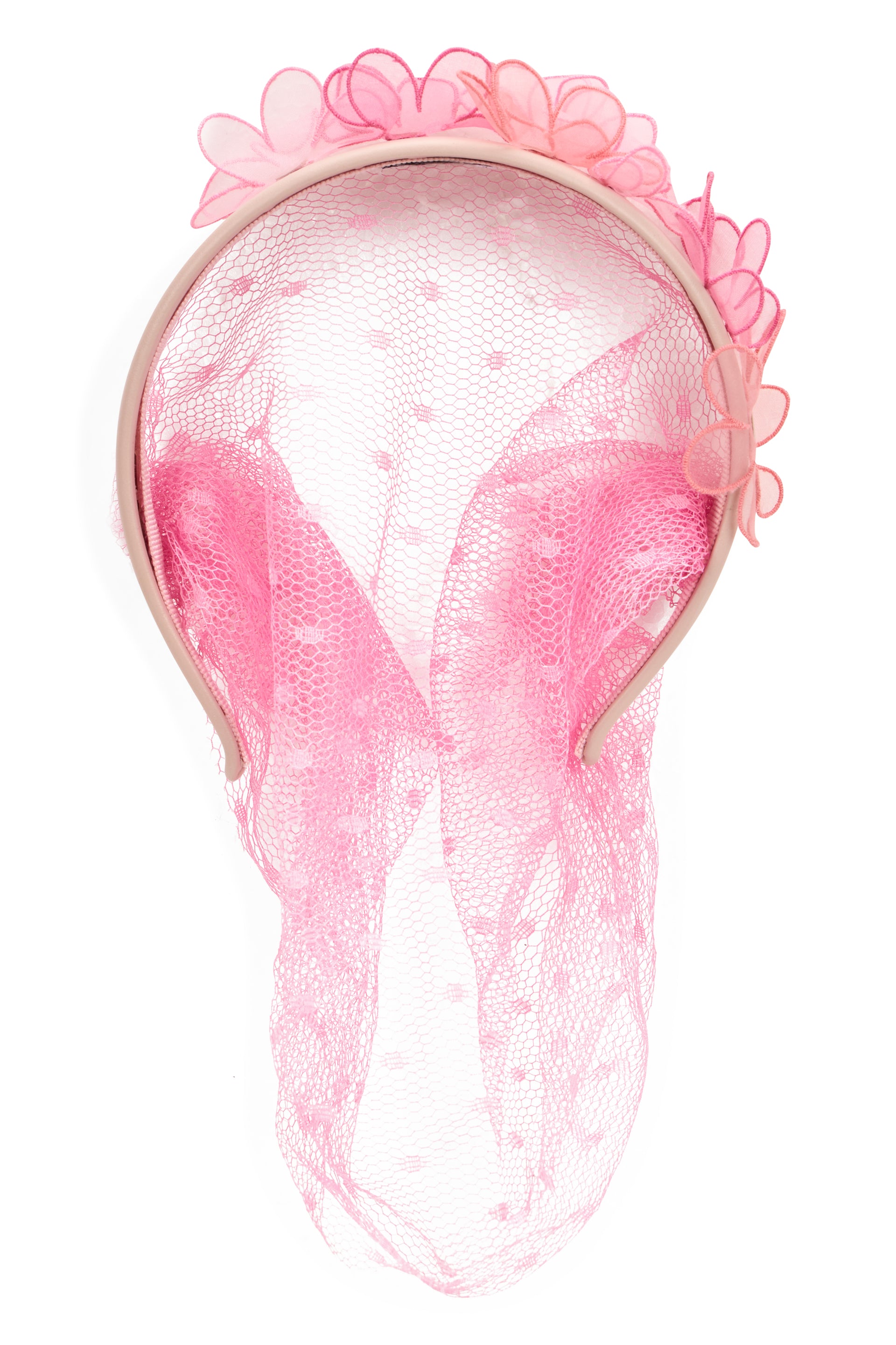 Headband for hair with pink tulle veil and floral ornament.