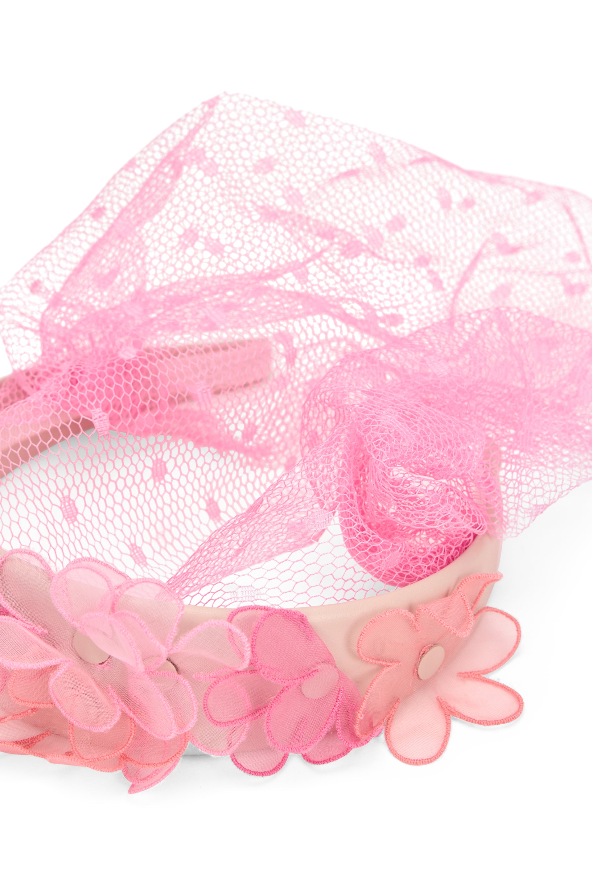 Headband for hair with pink tulle veil and floral ornament.