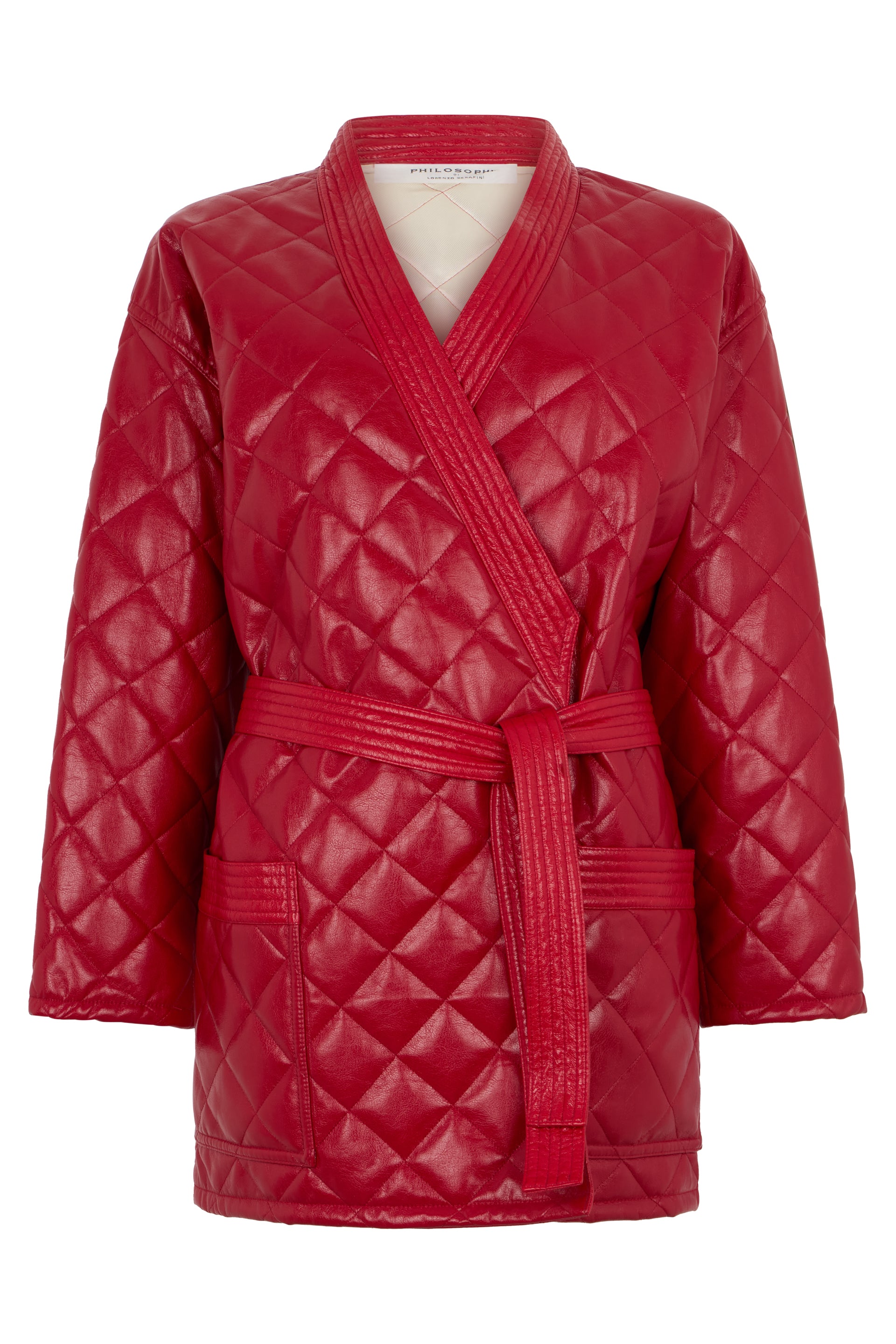 Red coat with belt at the waist of refined design.