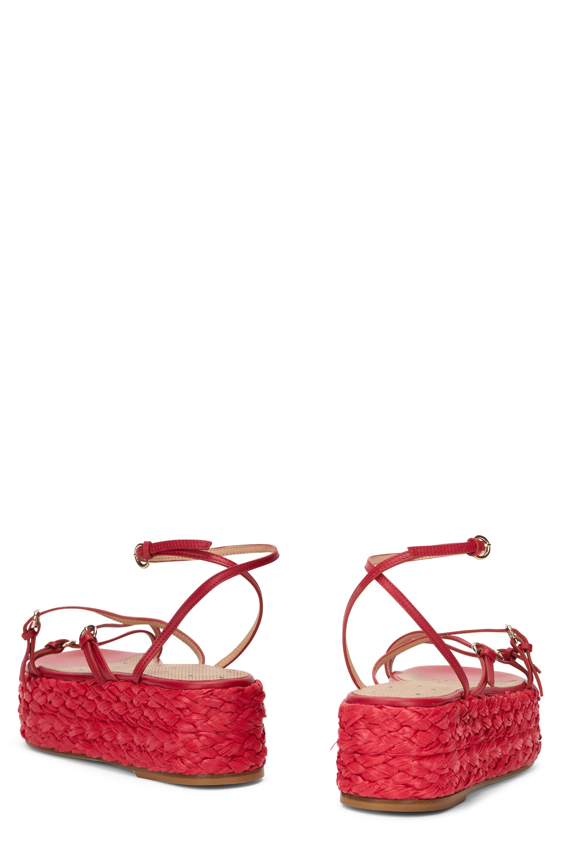 Red platform sandals with thin straps.