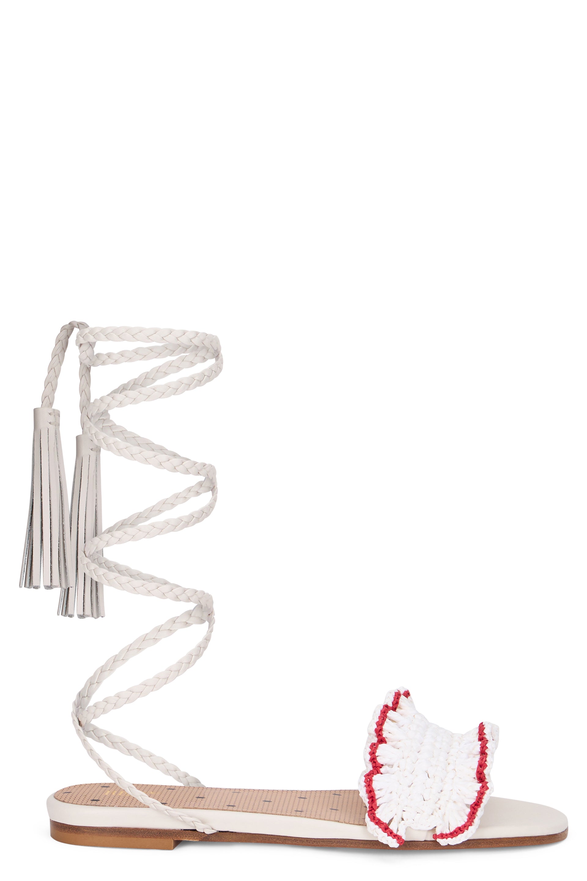 Elegant minimalist cream-colored sandals with straps around the calf.